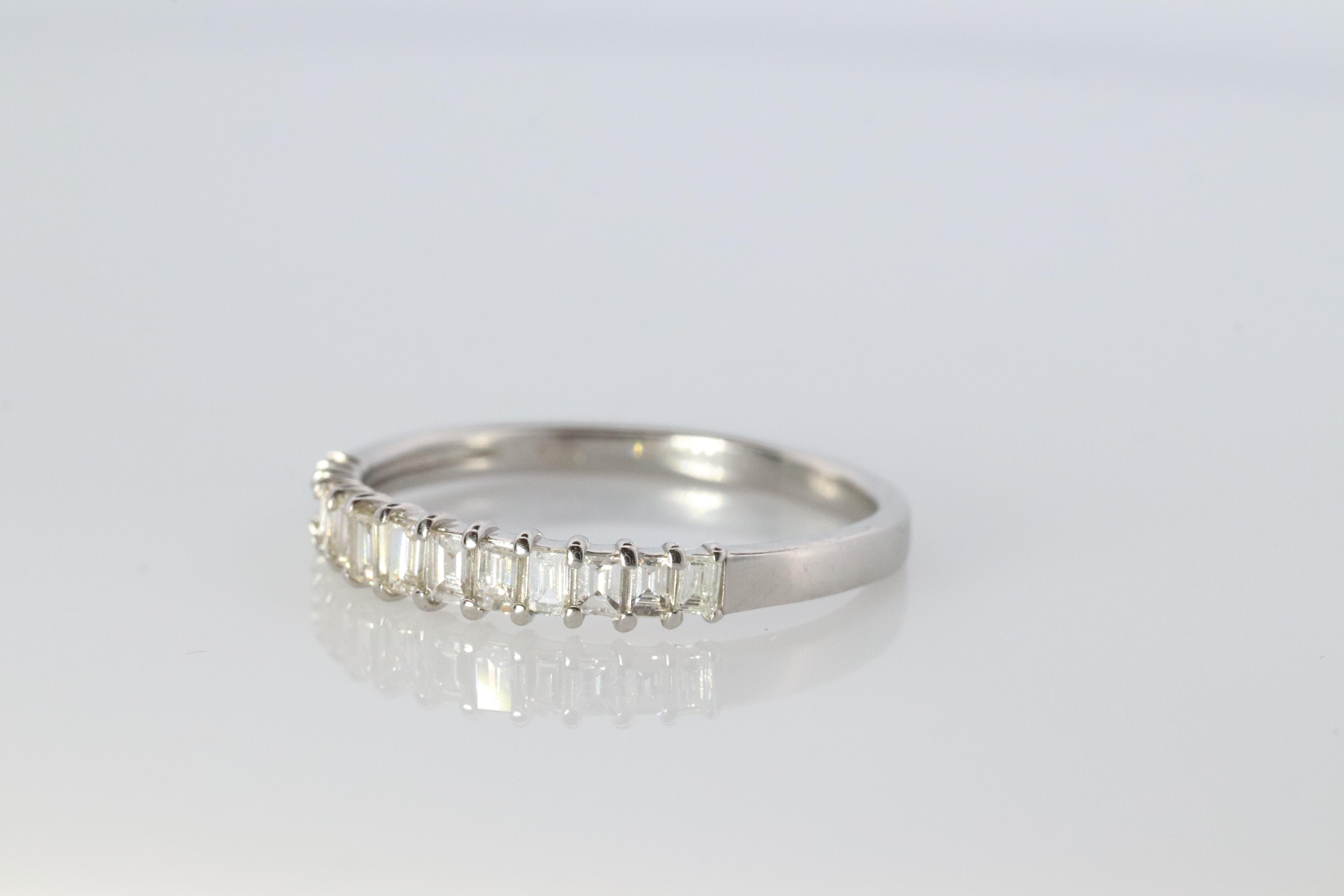 Beautiful Platinum band

Dainty design with Illusion set baguette diamonds.

0.30ctw Total Diamonds

Half set eternity band.

Details:

3.5mm wide band
VS clarity with G color


2.7grams total
Size 7.5