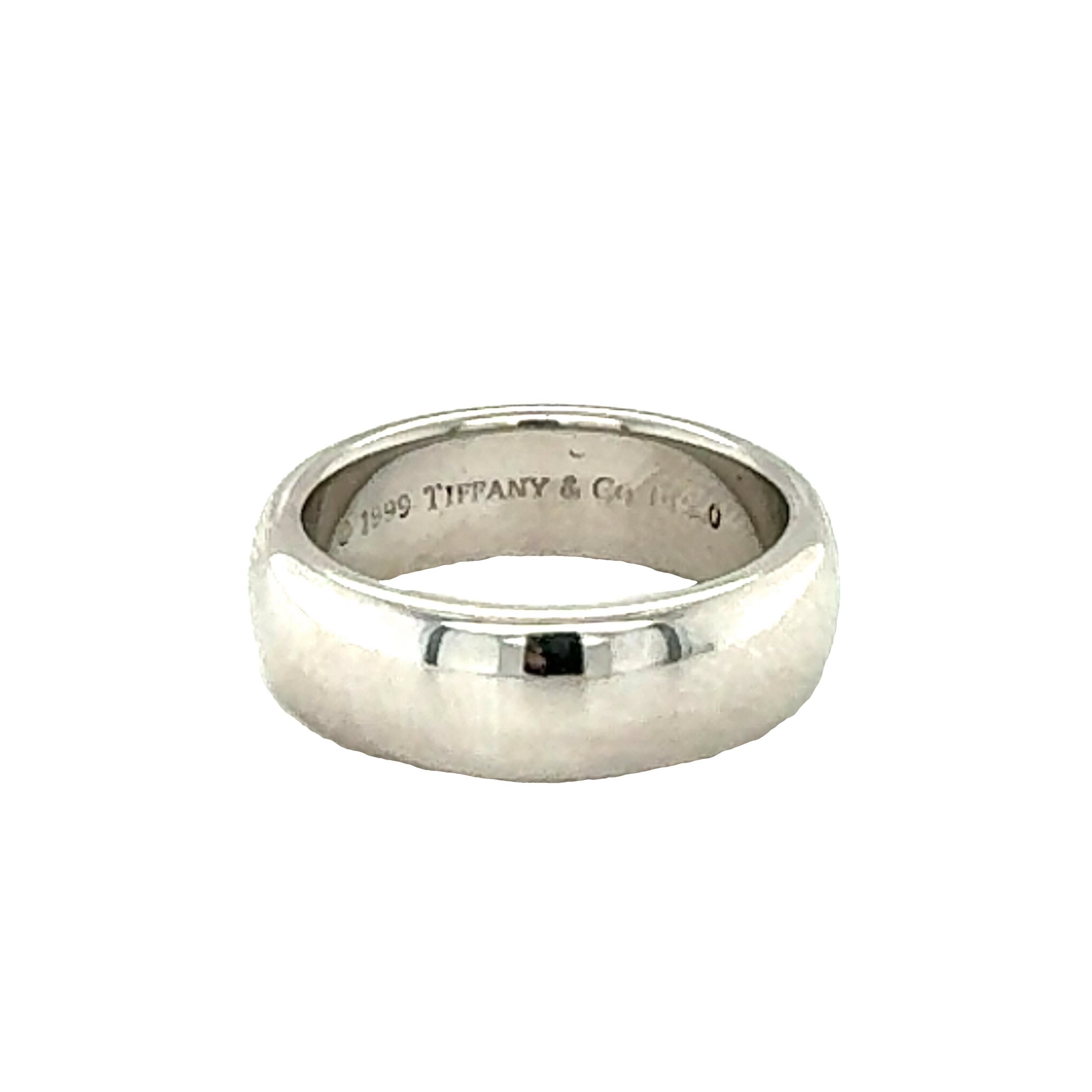 This classic platinum band by Tiffany & Co. exudes timeless elegance with its sleek, high-polish finish. Measuring 6 millimeters wide, this band has a modern yet understated appeal, perfect for daily wear or as a sophisticated statement piece.