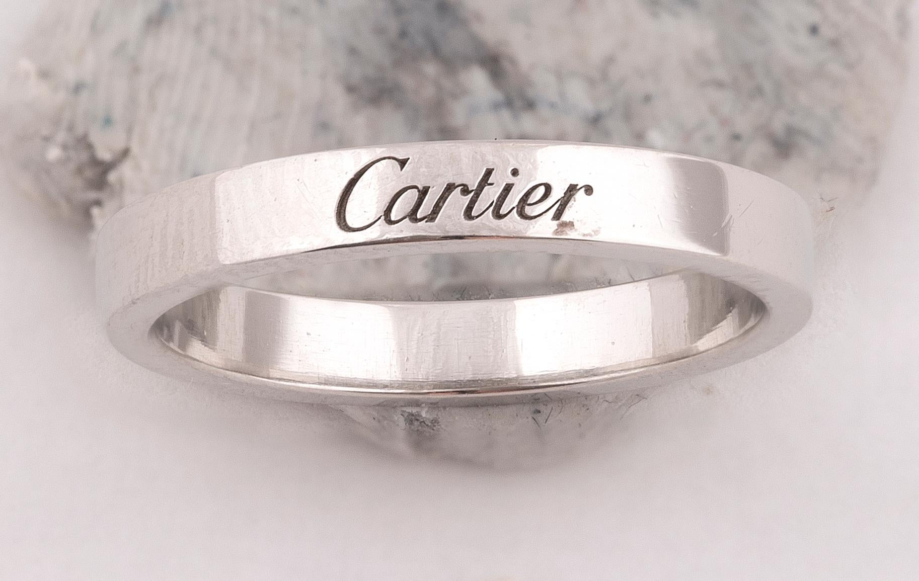 
Signed Cartier, IW 7749. Stamped 950. Ring size 7. Cartier size 55. 5.4gms.
