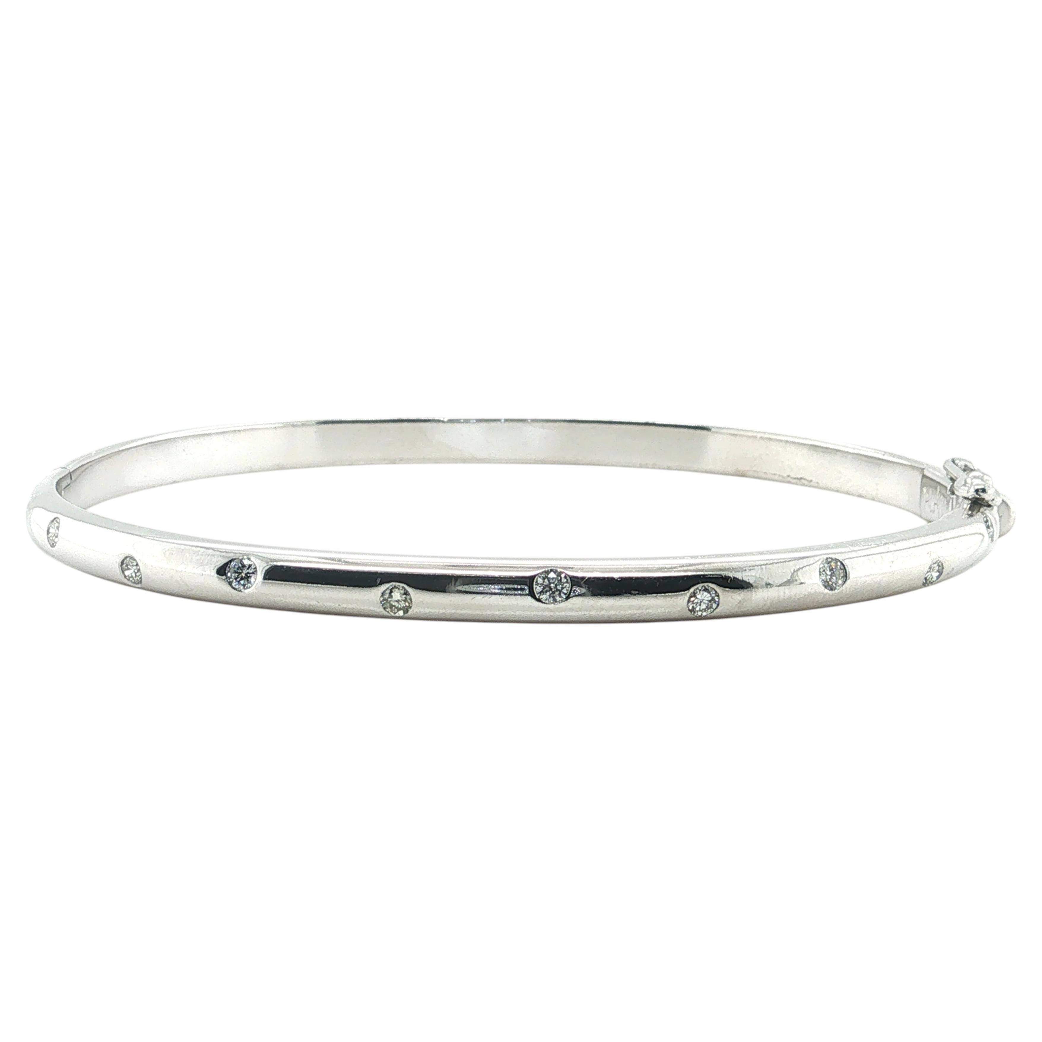 Bracciale rigido in platino con 10 diamanti rotondi, design artigianale