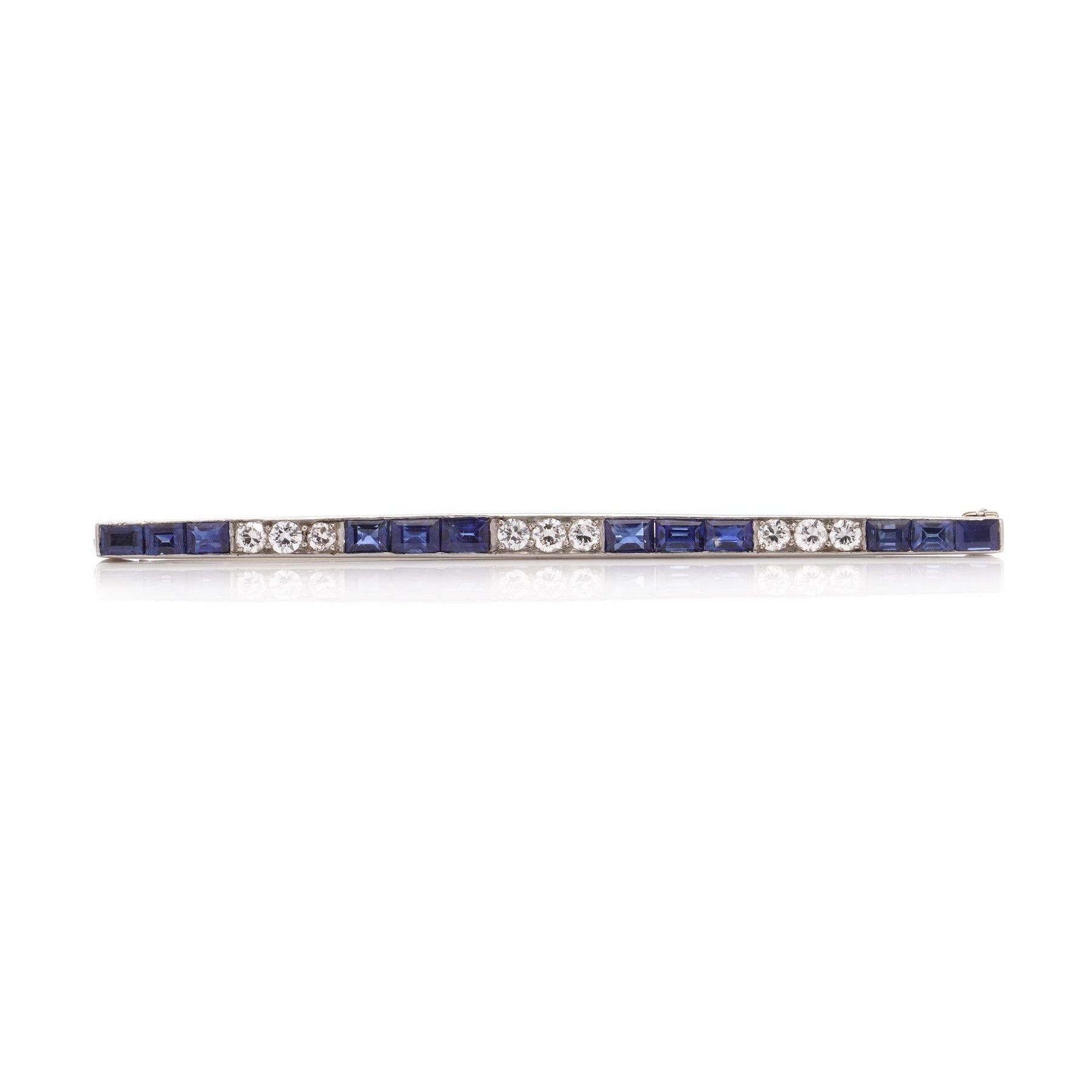 Vintage Platinum bar brooch set with calibre cut sapphires and round brilliant diamonds.
Made in Circa 1940's
X - ray tested positive for platinum. 

Dimensions: 
Length x width: 6.4 x 0.3 cm 
Weight: 5 grams 

Diamonds -
Cut: round
