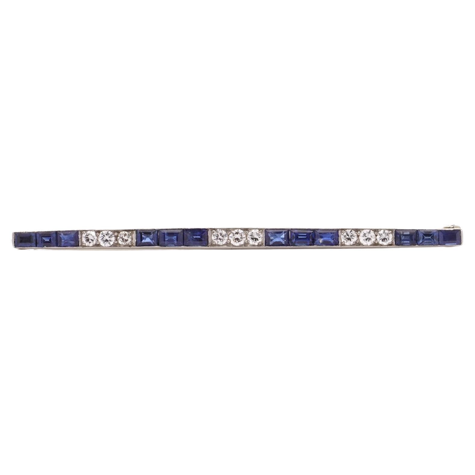 Platinum bar brooch set with sapphires and diamonds  For Sale