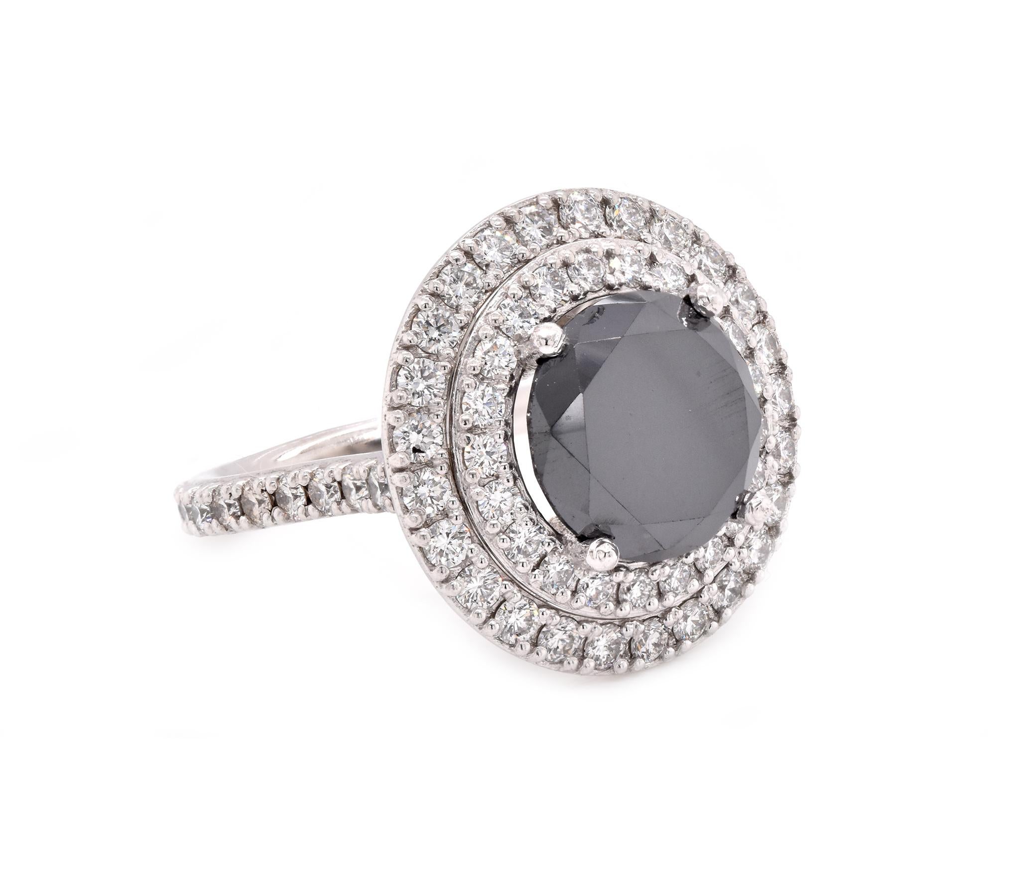 Material: Platinum 
Center Diamond: 1 round brilliant cut = 4.67ct
Color: Black
Diamonds: 65 round cut = 1.32cttw
Color: G
Clarity: SI1
Ring Size: 7 (please allow up to 2 additional business days for sizing requests)
Dimensions: ring shank measures