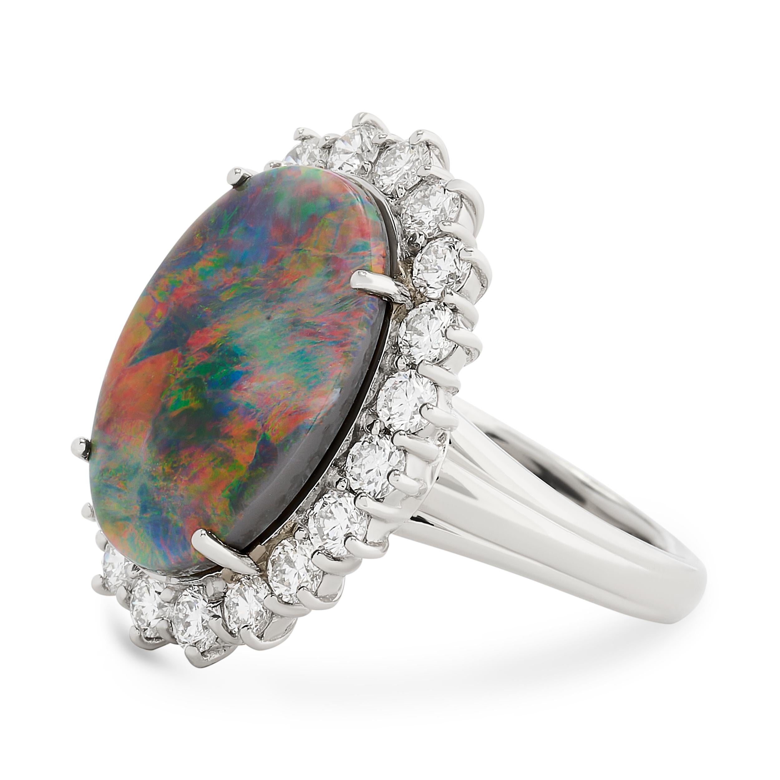 Oval Cut Platinum Black Opal and Diamond Halo Ring For Sale