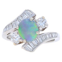 Bague bypass en platine, opale noire et diamants - cabochon ovale 1,52 carat