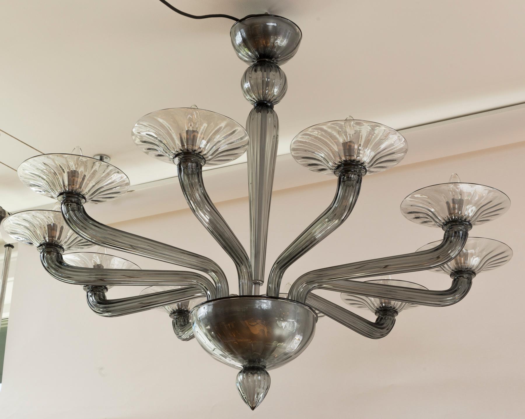 Elegant custom blown Murano Uplight Chandelier engineered so the canopy will install directly into the ceiling for a clean and sleek look. The center shaft comprised of three ribbed pieces with touch of black trim and a ribbed fluted column. Ten