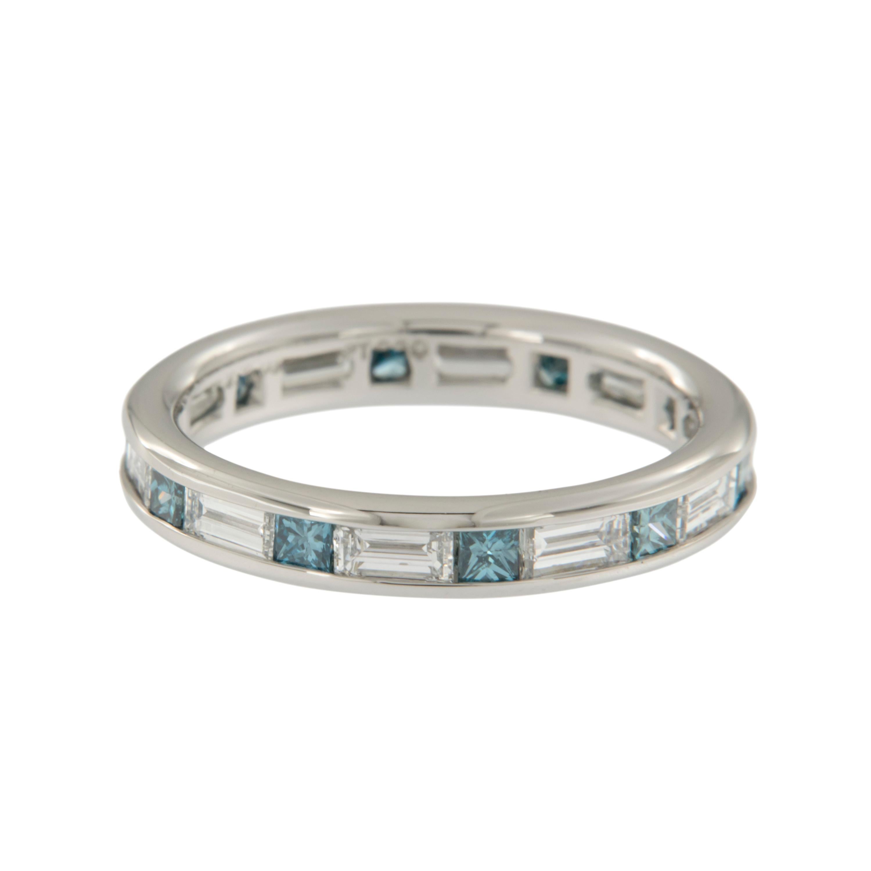 Made in New York, this lovely eternity band has 0.65 Cttw. tranquil treated blue diamonds alternating with 1.30 Cttw white baguette cut diamonds for a stunning contrast of color & diamond cuts. Known for their eloquence & sleek lines, baguette cut