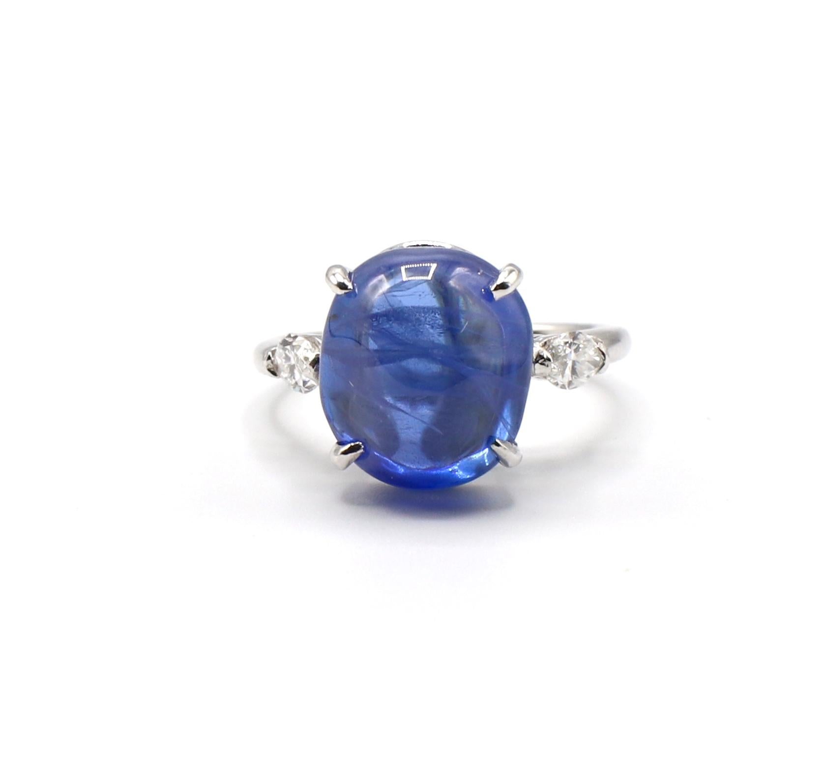 Platinum Blue Sapphire Cabochon & Diamond Cocktail Ring Size 5

Metal: Platinum
Weight: 4.65 grams
Diamonds: 2 marquise shaped diamonds, approx. .40 CTW G VS 
Sapphire: Cabochon/sugar loaf 11.3mm x 10.2mm x 6.5mm, approx. 5.25 cts
Band Thickness: