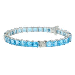 Bracelet ligne droite en platine avec topaze bleue et diamant