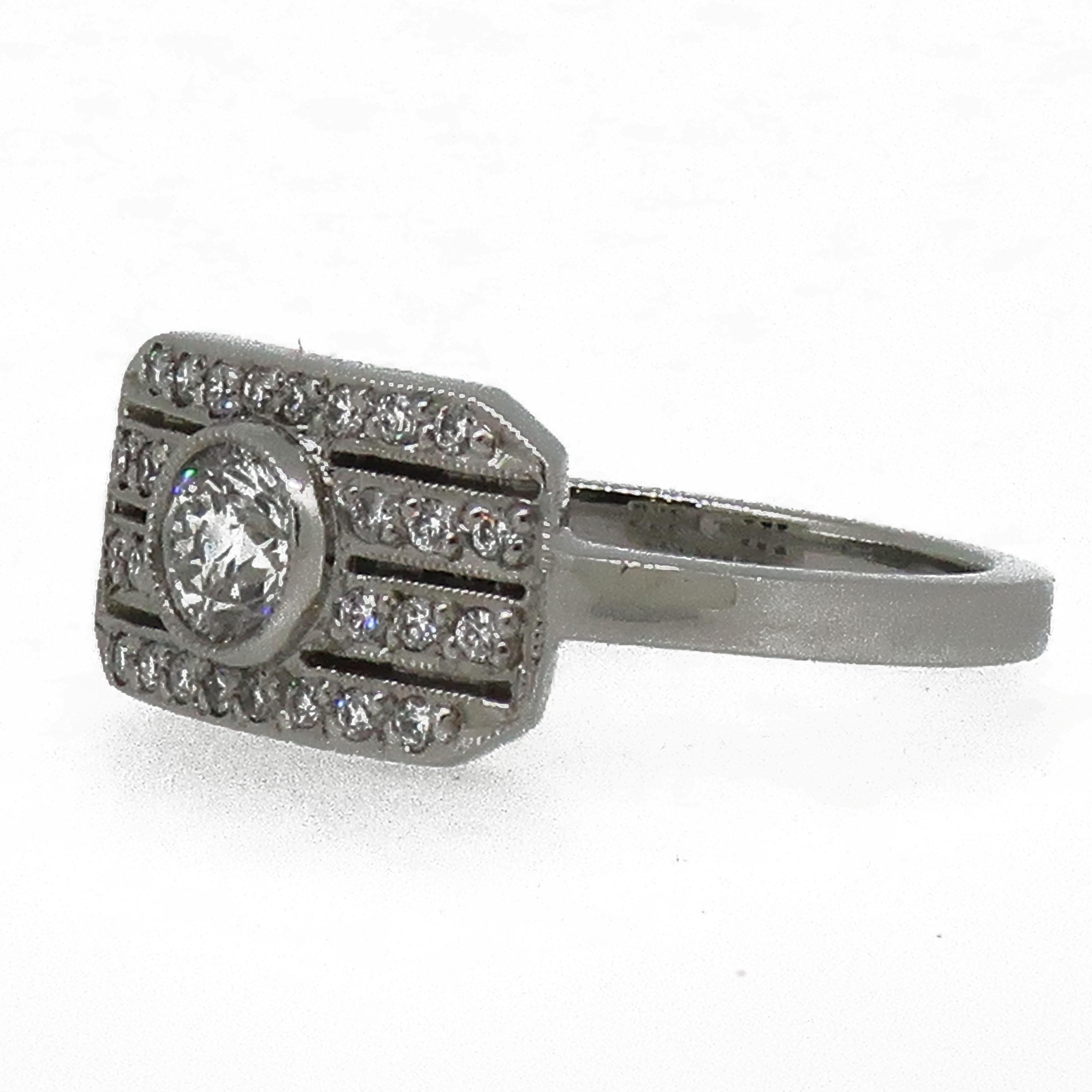 Platinum Brilliant Cut Diamond Art Deco Style Cluster Ring.

A classy brilliant cut diamond cluster ring. A plaque design set across the finger with a centrally set brilliant cut diamond in the middle of four rows of brilliant cut diamonds, all