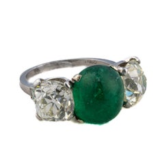 Platinum Cabochon Emerald and Old Mine Cut Diamond Three-Stone Ring