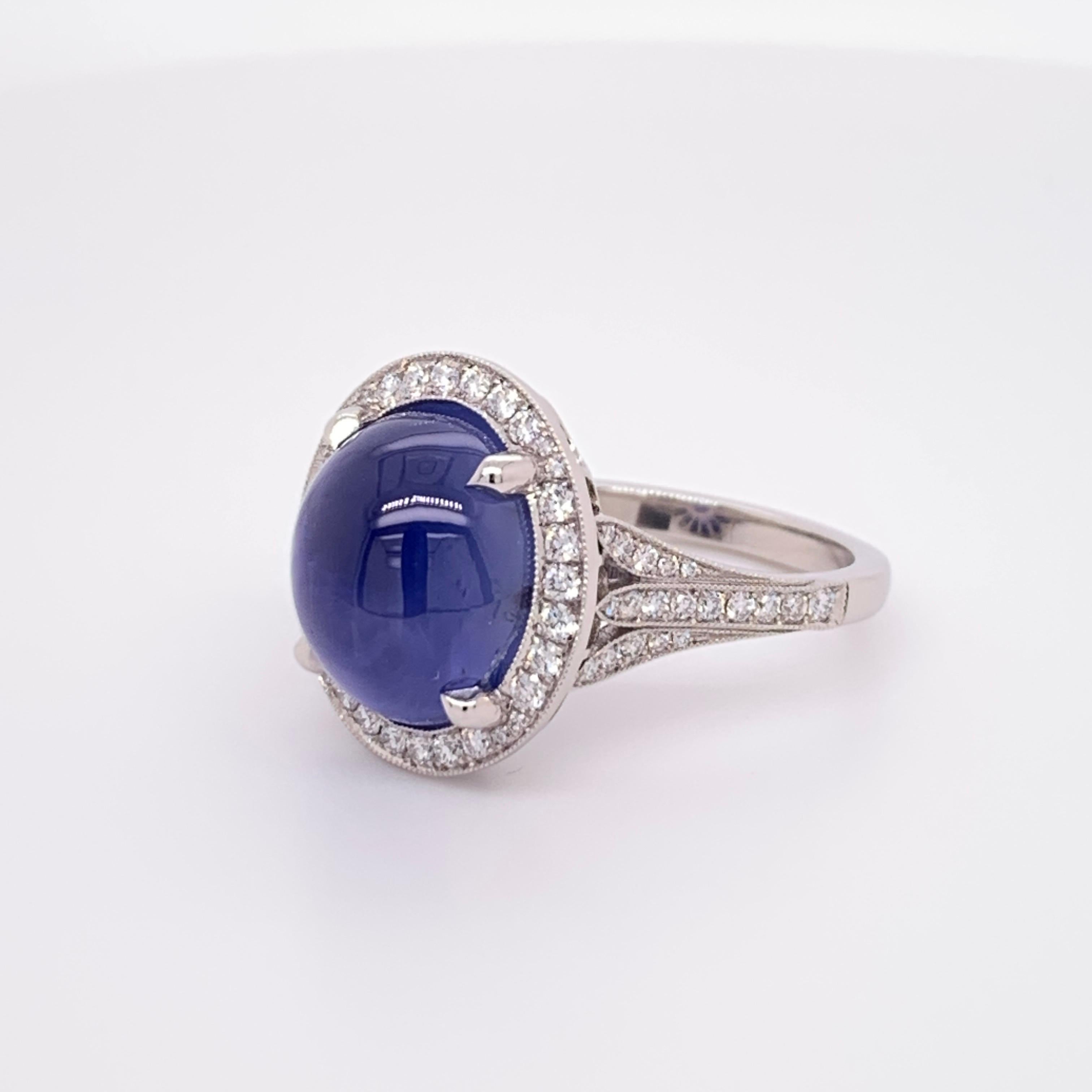 A stunning and elegant Natural Unheated Blue Star Sapphire GIA certified. NO HEAT TREATMENT.

The piece is platinum weighs 9.5 grams and the size is 5.75.

Set with 70 natural round brilliant diamonds weighing 0.45cts.