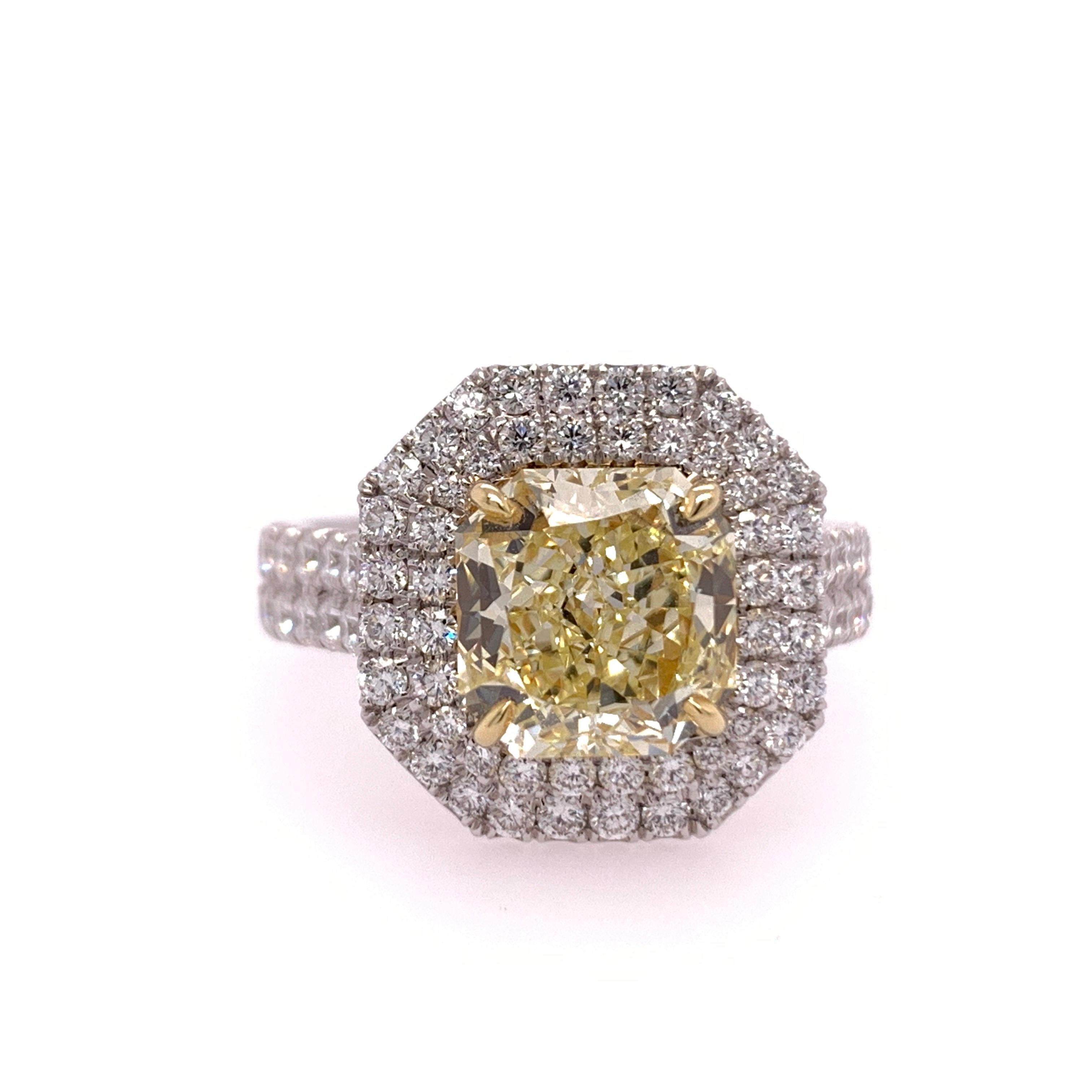 Radiant Cut Internally Flawless GIA Natural Fancy Yellow, the ring is set with 76 Natural Round Brilliant F VS diamonds weighing a total of 1.01 carats. 

Ring size is a 5.75+.

