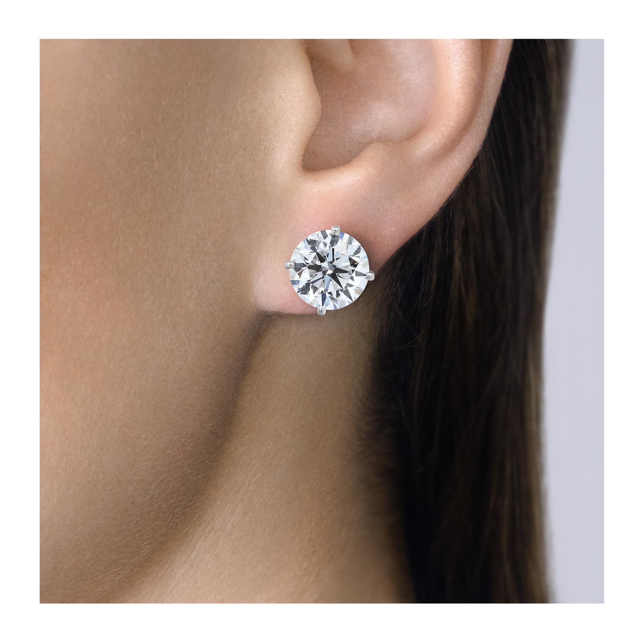Cartier diamond studs earrings, GIA certified, Round Brilliant Cut diamonds. Specification: 4.01carat E color, VVS2 clarity, Triple X. (Excellent cut,  polish and symmetry) and 4.05 carat E color, VVS2 clarity, (Very good cut, Very good polish and