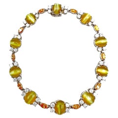 Bracelet en platine, chrysobéryl œil de chat, diamants naturels jaunes et blancs