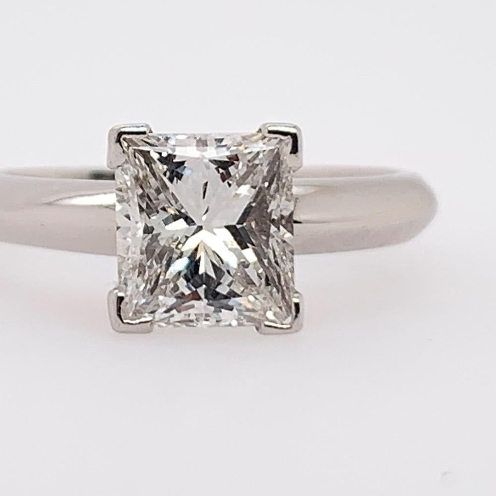 A stunning platinum princess cut diamond engagement ring. The center stone is a 1.52 carat EGL USA certified G color and VS2 clarity diamond, measuring 6.77x6.15x4.47mm with no fluorescence.

The ring is size 4.75 and weighs 4.93 grams. 