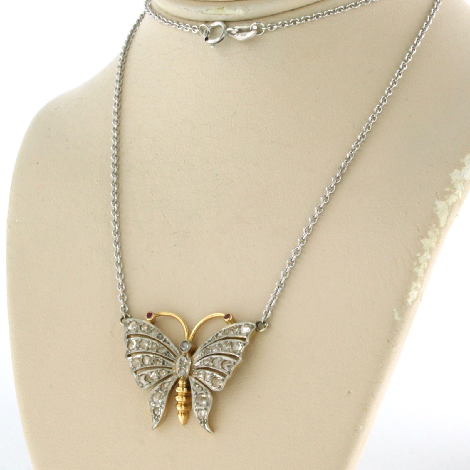 Platinum chain and a gold and platinum butterfly pendant with diamonds and ruby In Good Condition In The Hague, ZH