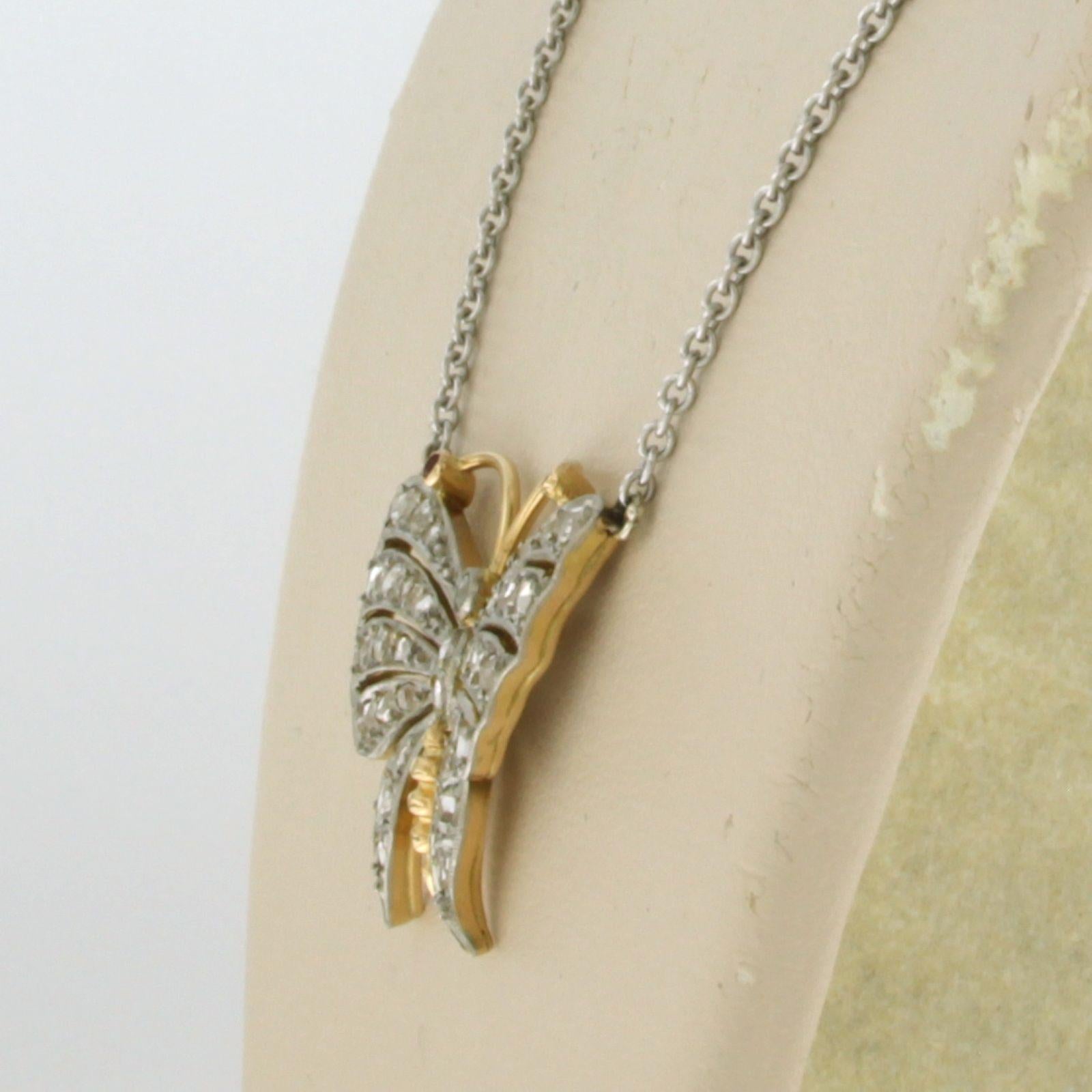Men's Platinum chain and a gold and platinum butterfly pendant with diamonds and ruby