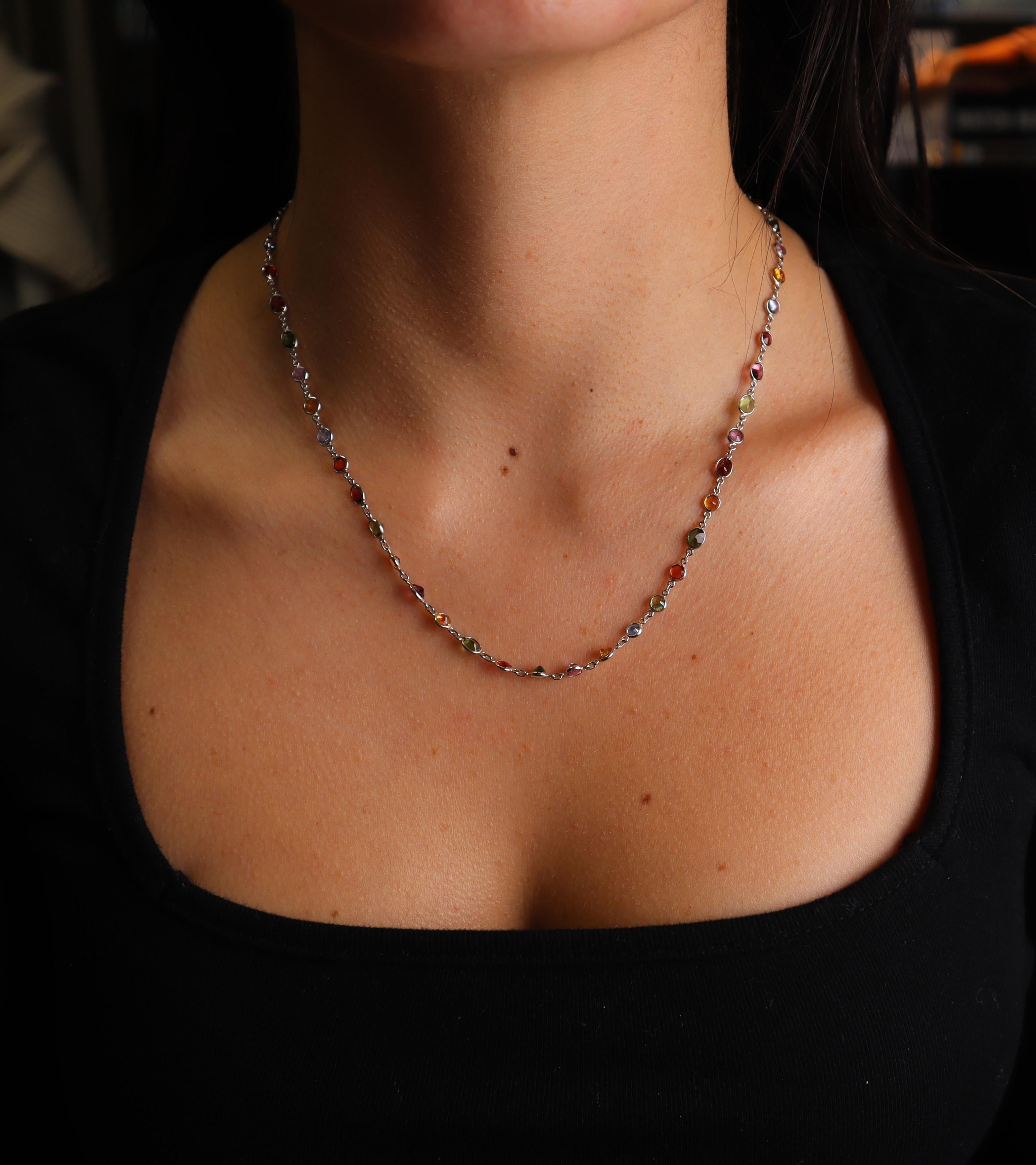 Introducing a stunning Platinum Chain Necklace that features 49 colored natural sapphires with a total weight of approximately 34.0 carats. This exquisite piece is designed to captivate with its vibrant array of colors, showcasing red, blue, pink,