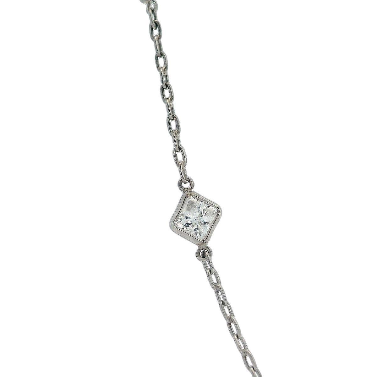 Presenting an exquisite Long Platinum Chain Necklace that is elegantly accented with 20 princess cut diamonds weighing a total of 5.35 carats. Each diamond is graded as colorless (H-I color) with SI clarity, ensuring a stunning sparkle that captures