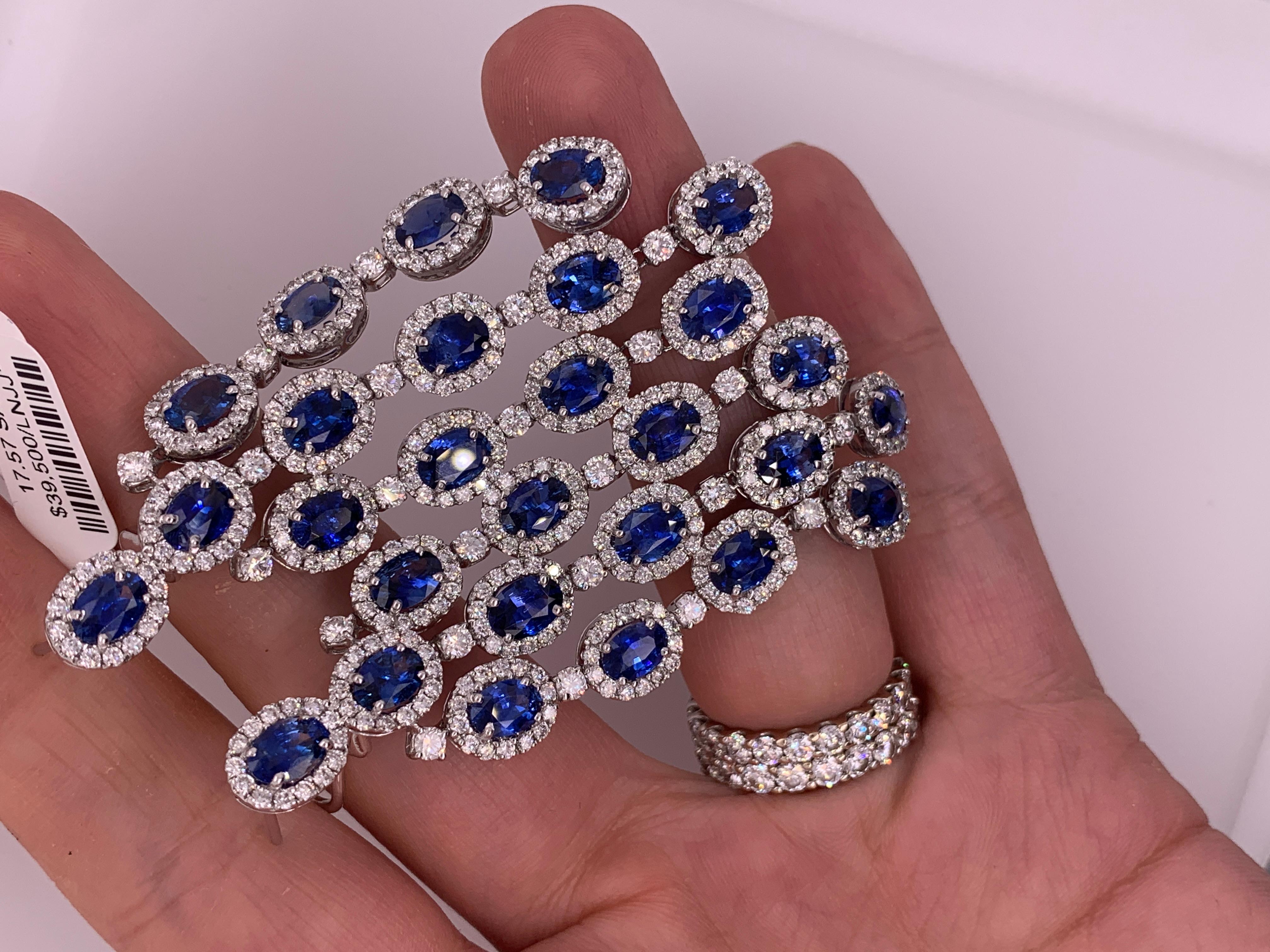 Platinum Chandelier Sapphire and Diamond Earrings, features 17.57 Carats of sapphires and 7.00 carats of diamonds. 2.5 inches long 
