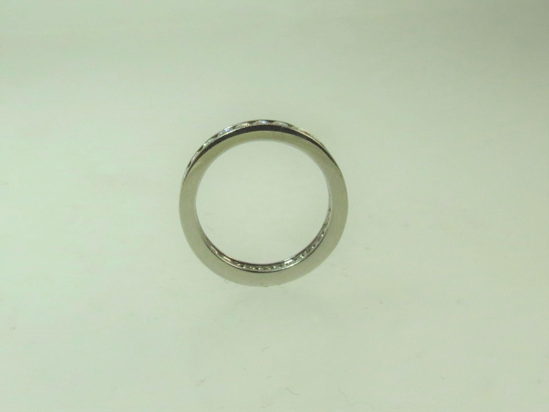 Round Cut Platinum Channel Set Band Ring with Round Diamonds Weighing .95 Carat For Sale