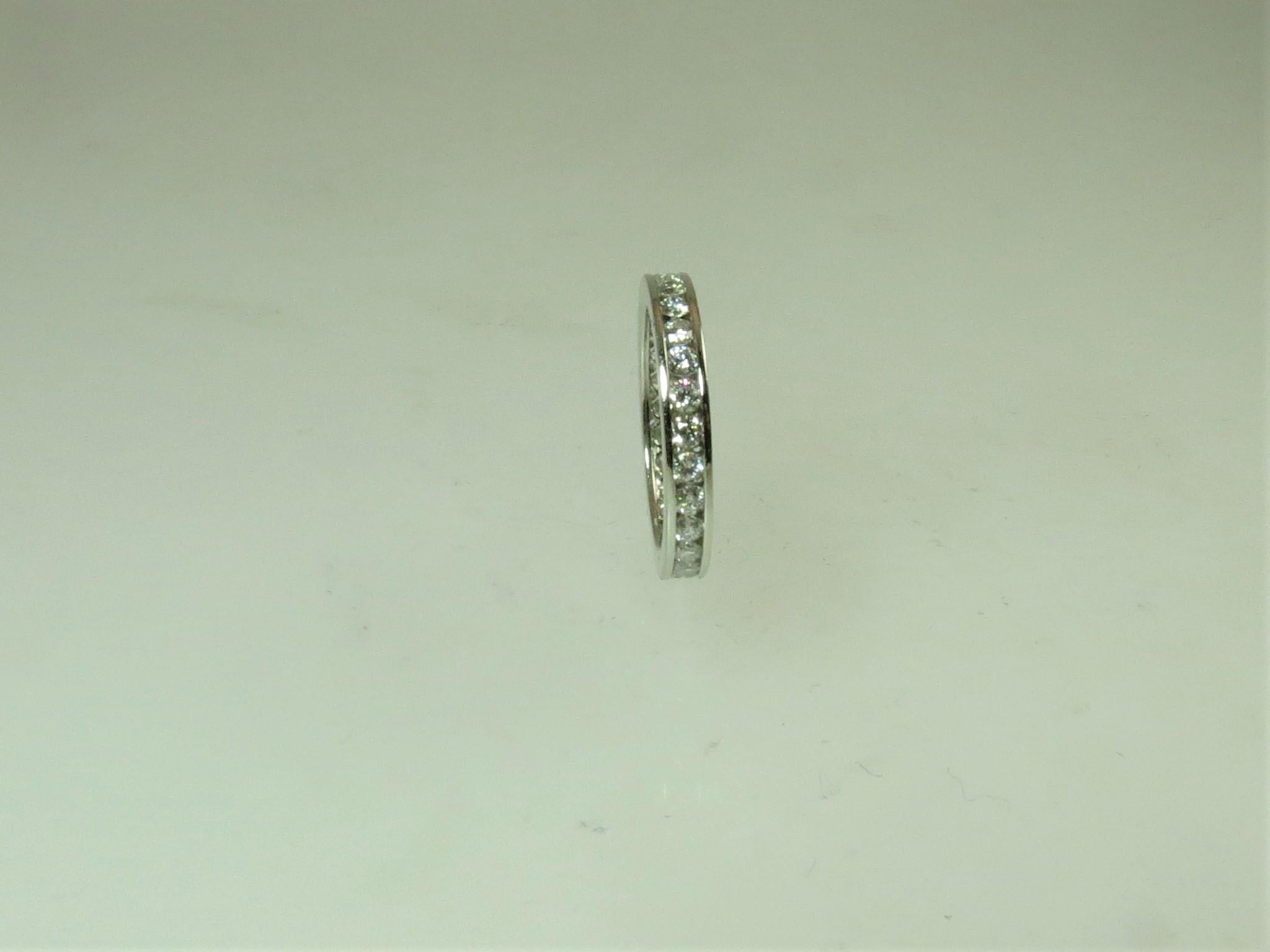 Platinum Channel Set Band Ring with Round Diamonds Weighing .95 Carat In New Condition For Sale In Chicago, IL
