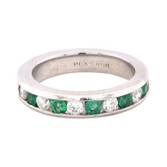 Platinum Channel Set Diamond and Emerald Band