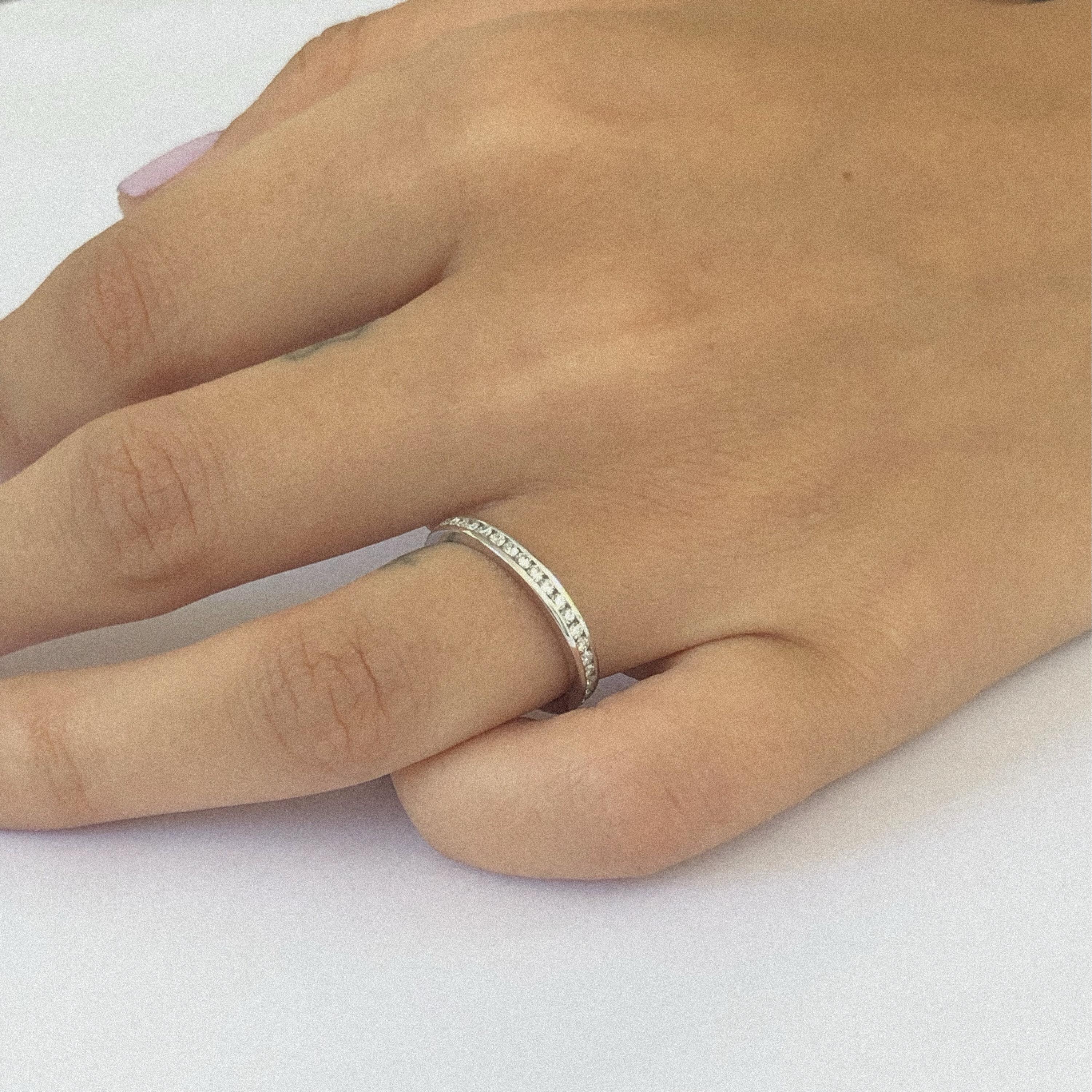 Platinum channel set 2.5 millimeter diamond wedding band or stacking ring
Diamond weight 0.60
Diamond quality G VS
Our team of graduate gemologists carefully hand-select every diamond and sapphire . 
Ring size 6 
Ring cannot be sized
