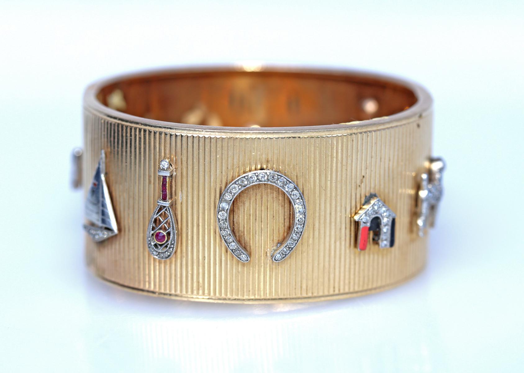 Retro Cuff Bracelet Enhanced by Applied Charms and Stickpins with Diamonds Sapphires in Yellow Gold. In my 40 years of collecting antiques, I have never come across an item that would be all about luck. The bracelet is a collection of everything