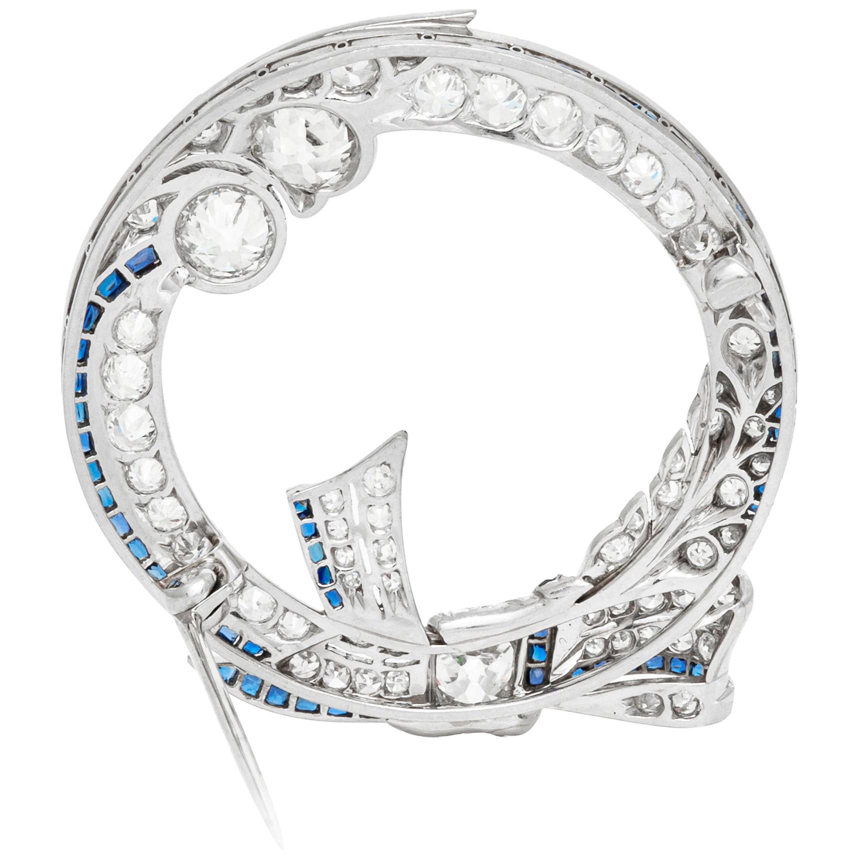 Platinum Circle with Bow Tie with Diamond and Sapphire