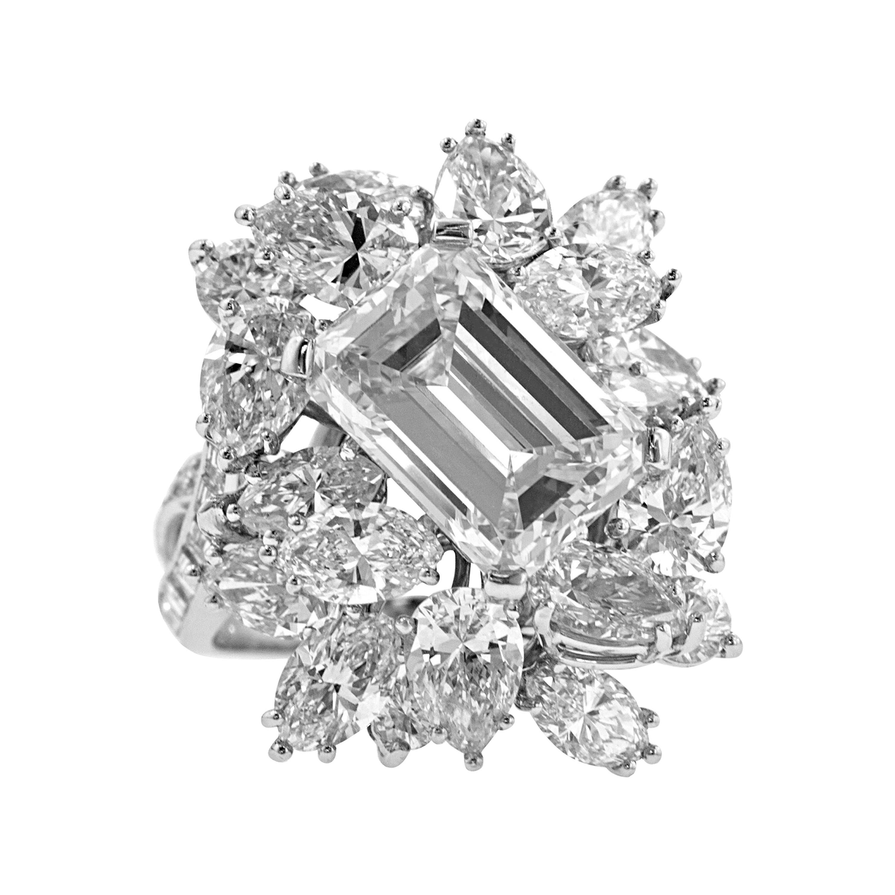 Magnificent Emerald Cut Diamond Platinum Cluster Ring For Sale at