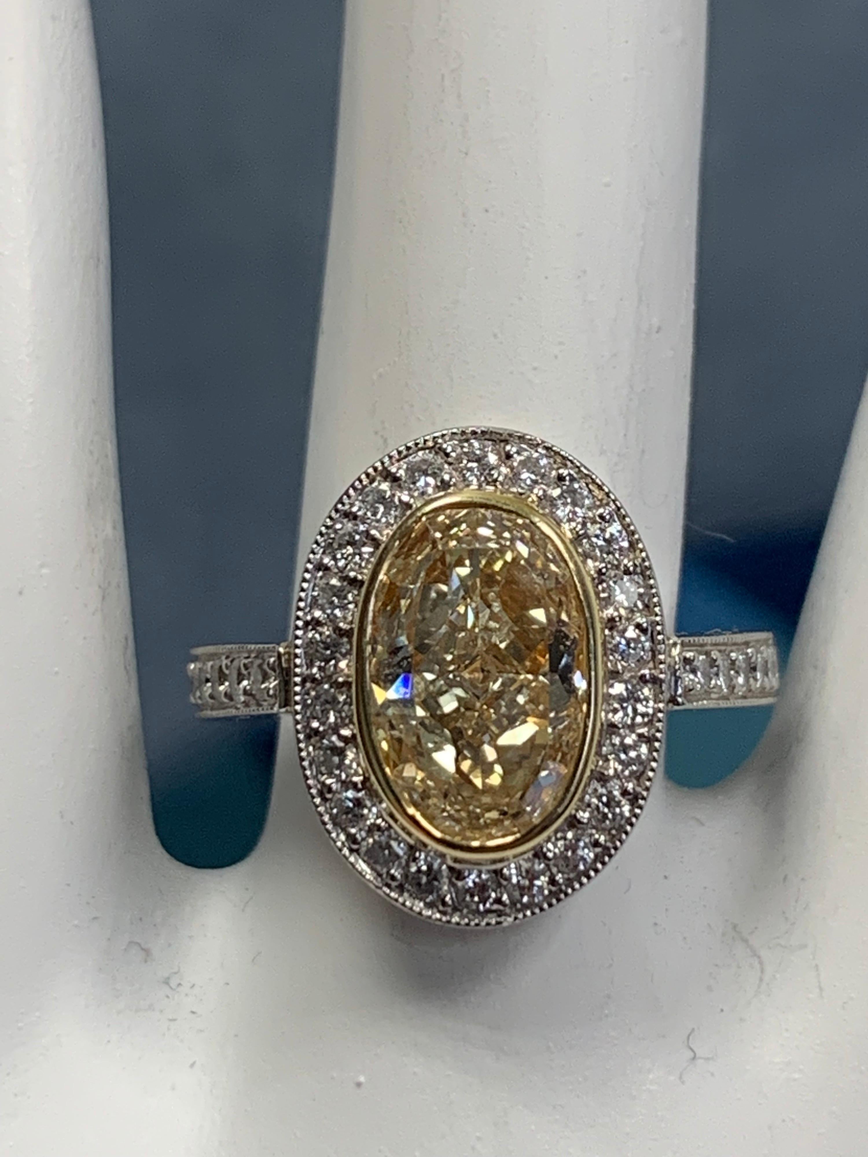 Oval Cut EGL Certified 2 Carat Natural Oval U-V Light Yellow VS2 Diamond Engagement Ring For Sale