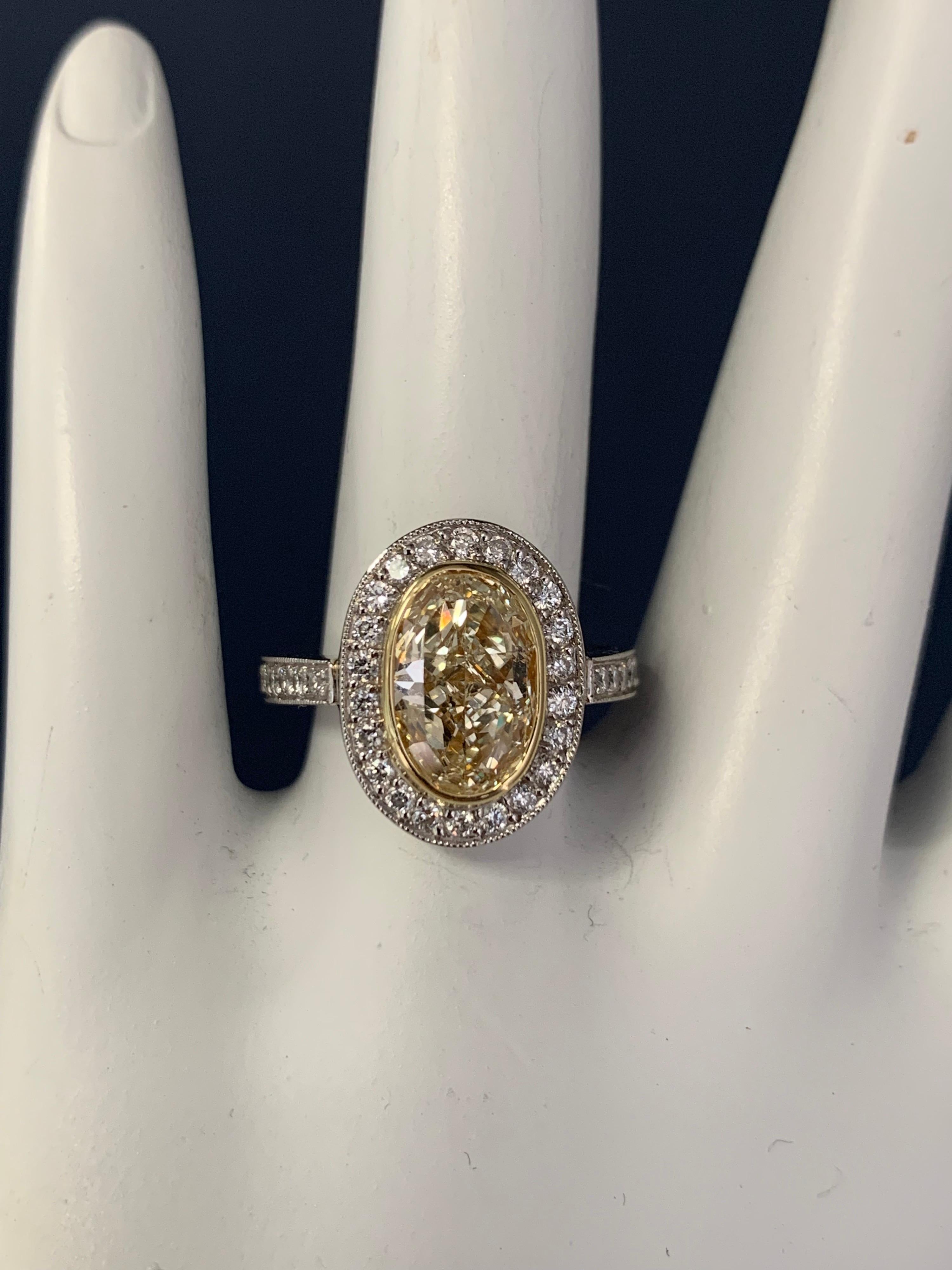 EGL Certified 2 Carat Natural Oval U-V Light Yellow VS2 Diamond Engagement Ring In Good Condition For Sale In Los Angeles, CA