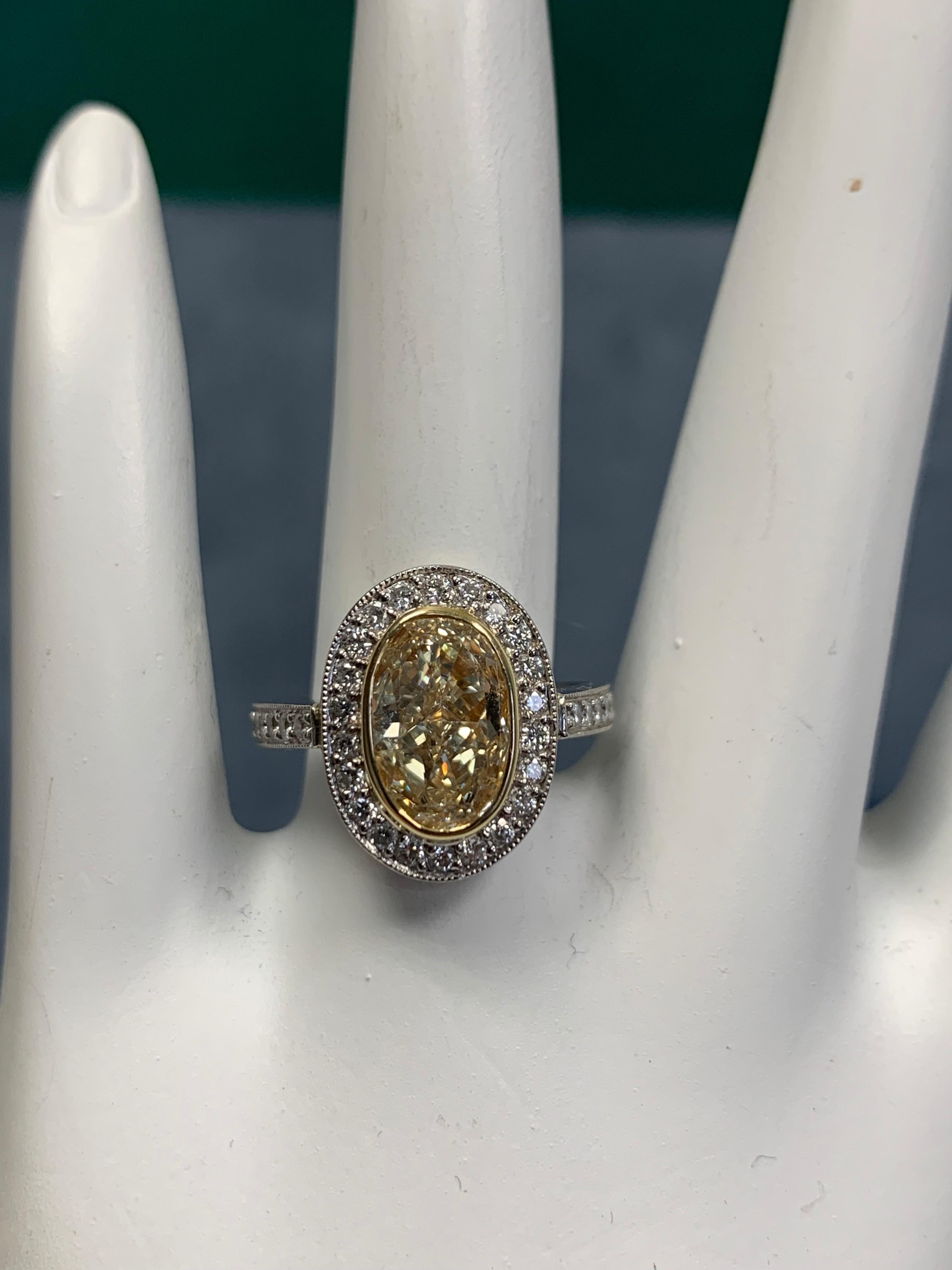 Women's EGL Certified 2 Carat Natural Oval U-V Light Yellow VS2 Diamond Engagement Ring For Sale