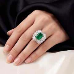 Platinum Art Deco Colombian Emerald Diamond Cluster Ring, Circa 1970