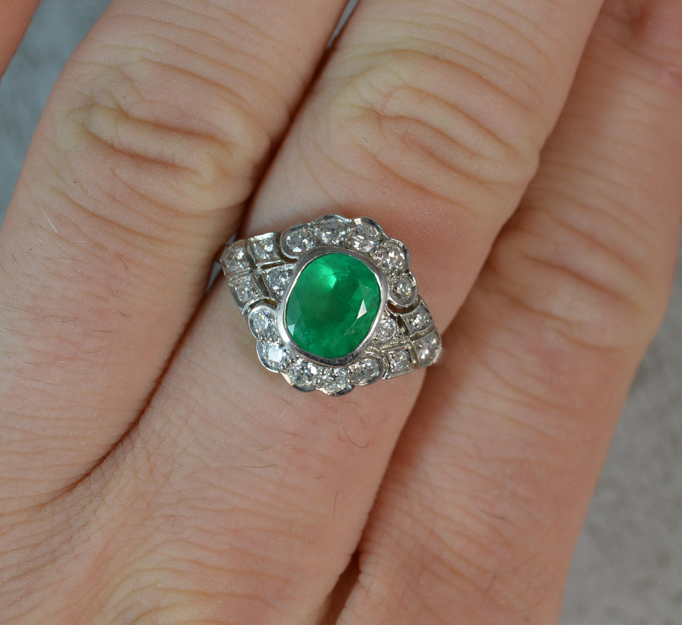 A stunning natural Emerald and Diamond ring.
Ring Size; N UK, 6 3/4 US
Modelled in 950 grade platinum.
Designed with a cushion oval emerald, believed to be of Colombian origin in bezel setting. Surrounding are 18 natural Vs clarity diamonds in grain