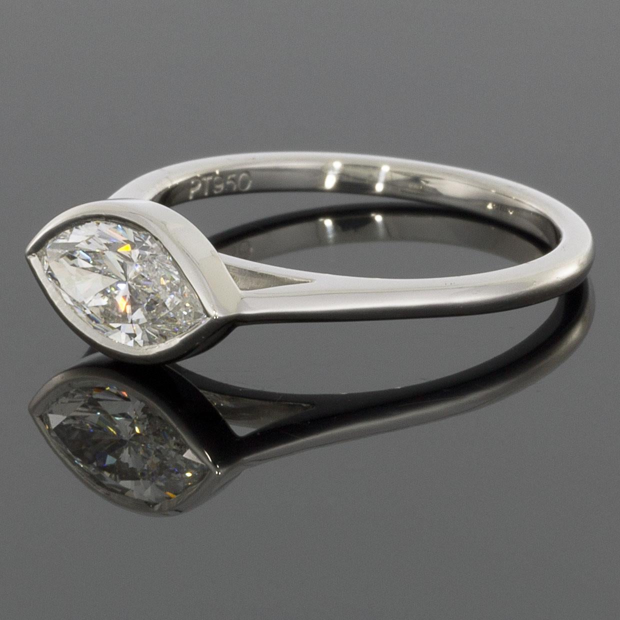 Custom Designed East-West or Horizontal Bezel Solitaire Engagement Ring - Perfectly fits the GIA certified marquise brilliant cut center diamond & allows any straight wedding band to fit snug & flush!

Item Details:
Estimated Retail $9,000.00
Metal