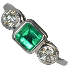 Platinum Columbian Emerald and 0.50 Carat VS Diamond Trilogy Engagement Ring