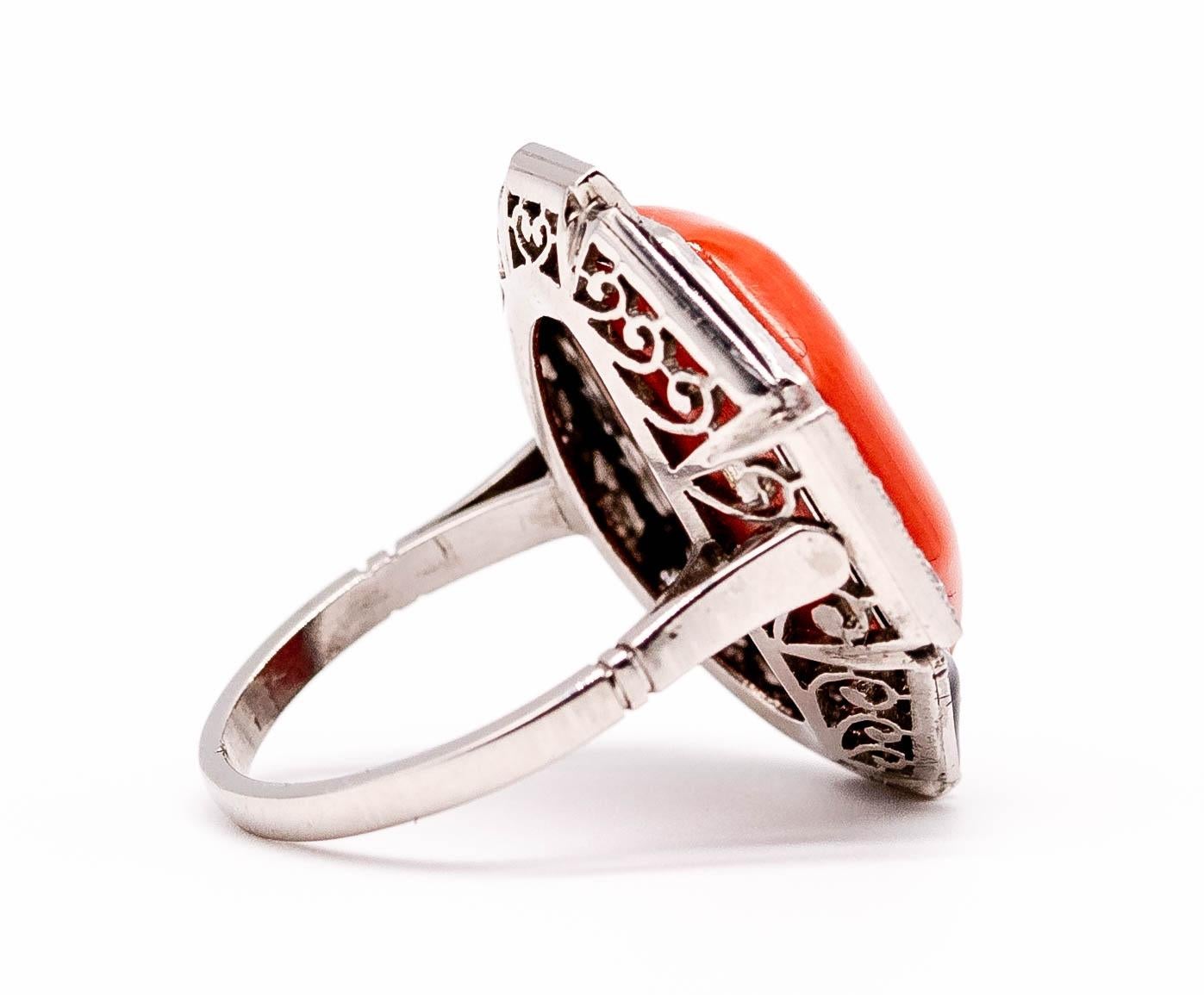 A luscious contrast of bright orange coral and shiny black enamel framed by old cut diamonds, this gorgeous ring lies flat on the finger so it's easy to wear more often than you would expect.  The ring measures 1