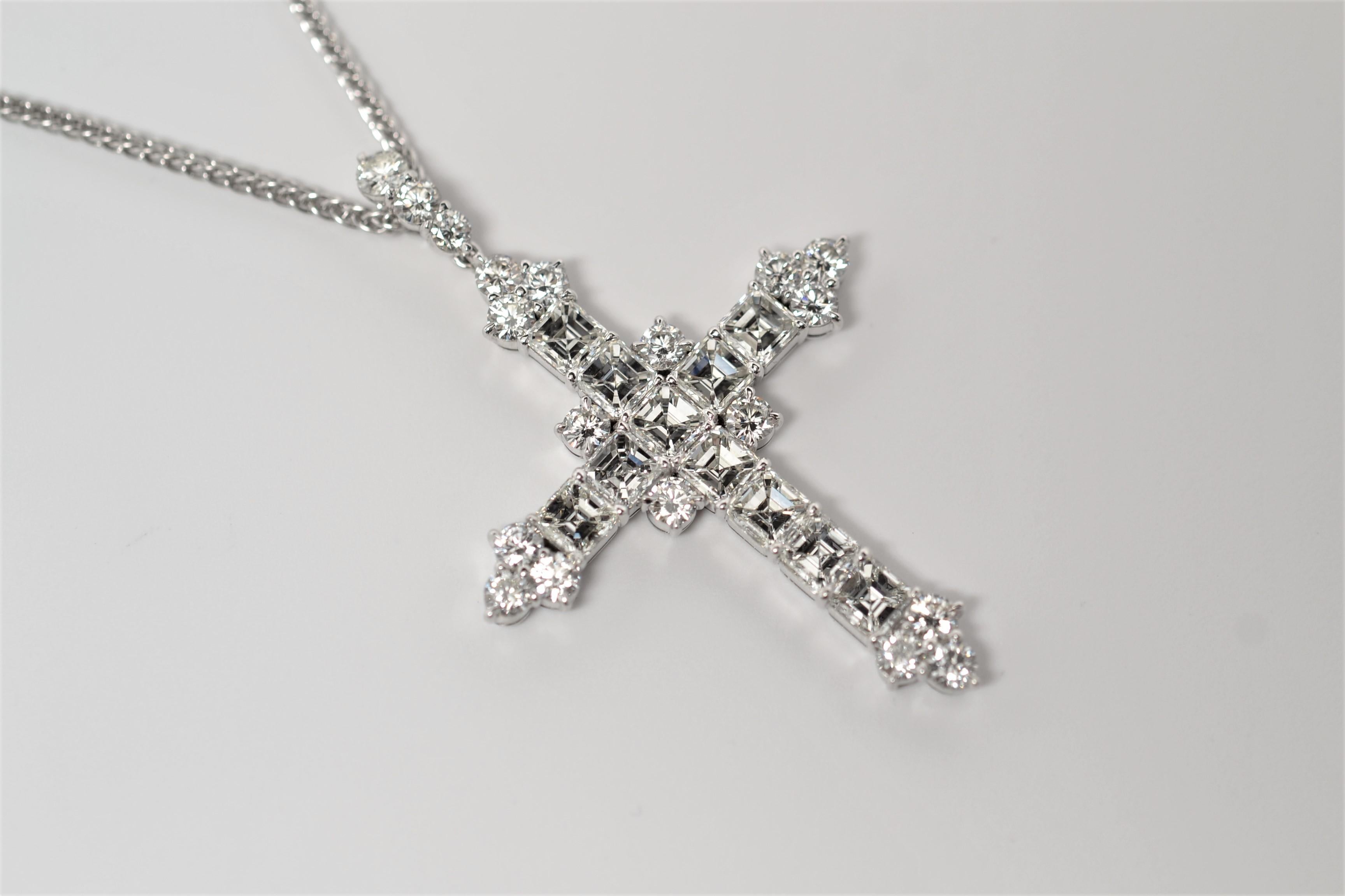 Finely crafted Platinum and Diamond Cross Necklace set with Asscher Cut and Round Brilliant Cut Diamonds. Eleven (11) Asscher Cut Diamonds with a total weight of 3.52ct and nineteen (19) Round Brilliant Cut Diamonds with a total weight of 1.68ct. 