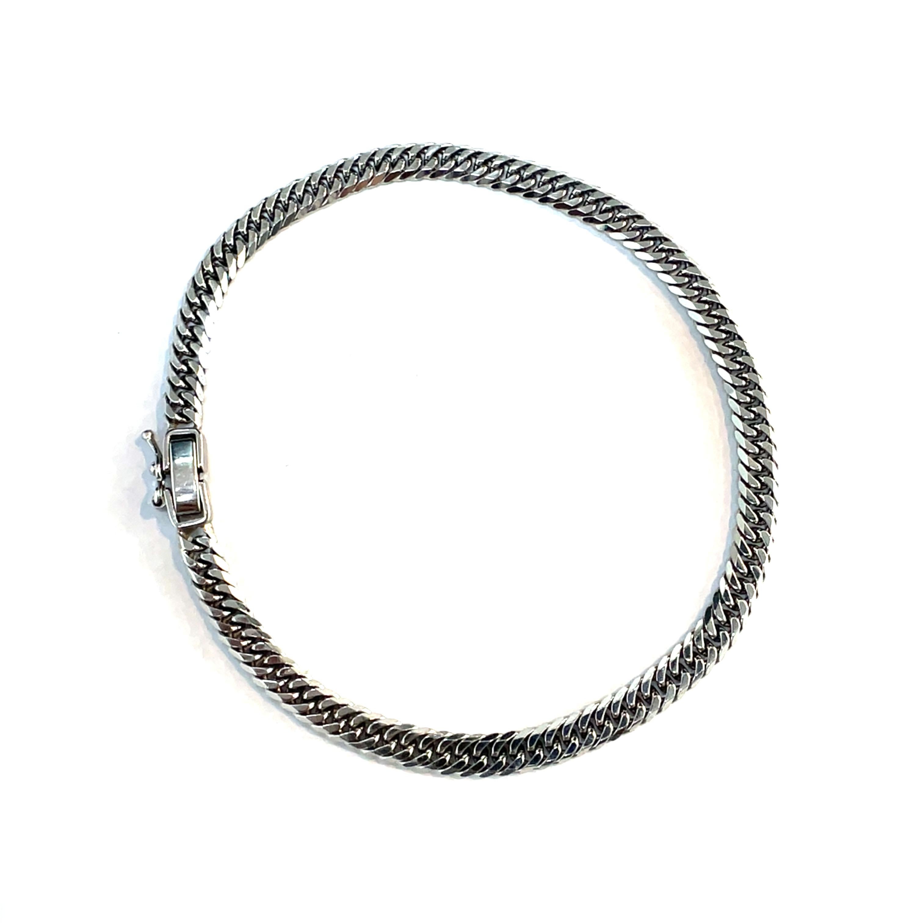 Discover the refined allure of this Platinum Cuban Link Bracelet, a sophisticated accessory designed to enhance any outfit. Crafted with precision, this bracelet showcases a sleek, polished platinum chain that exudes a modern elegance. Weighing 12.8
