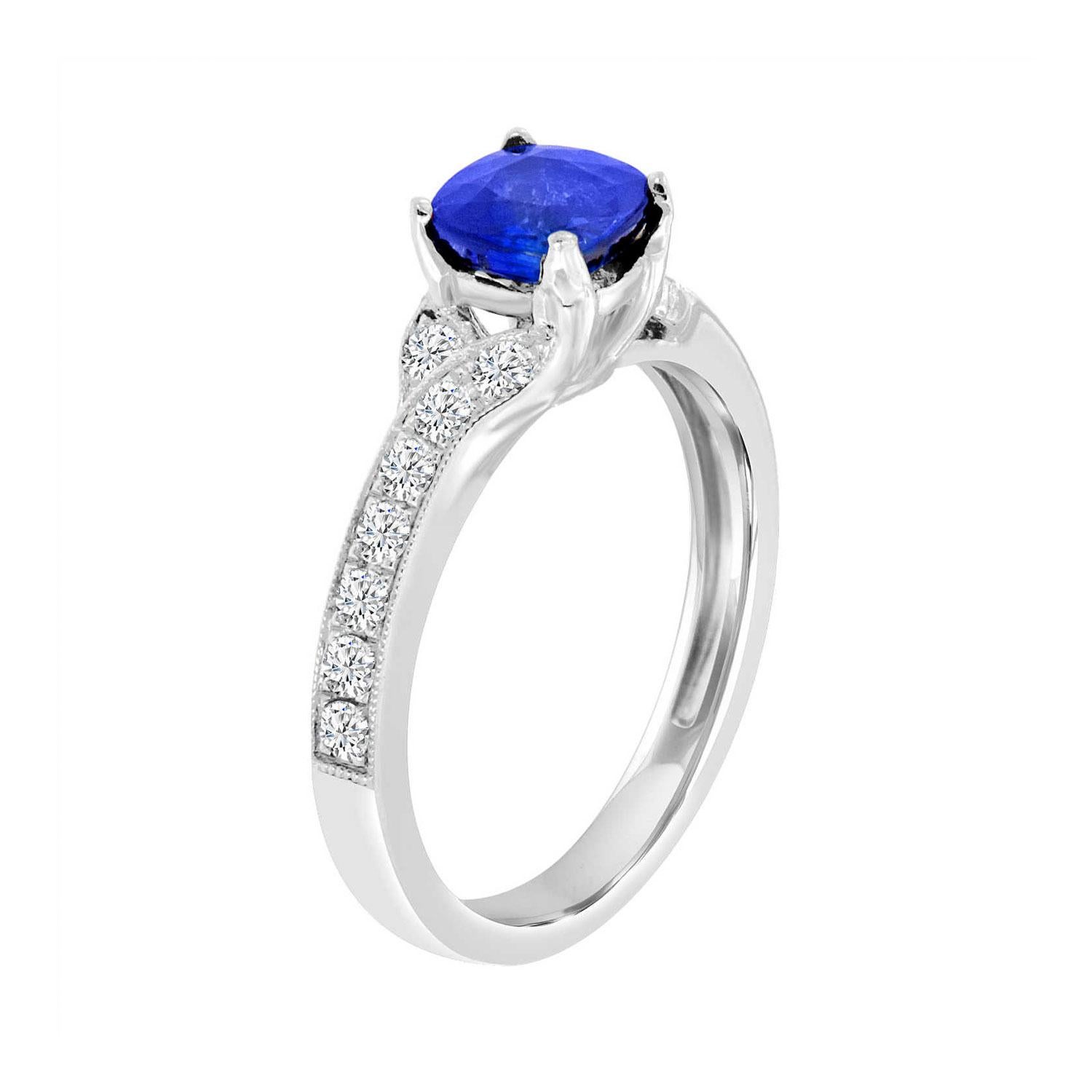 This vintage-inspired ring features a 1.25 Carat Square Cushion shaped Premium Blue Sapphire four prong set along a leaf design shank with a touch of milgain on its edge. The pave' set diamond along the shank ad a dazzling effect. Experience the