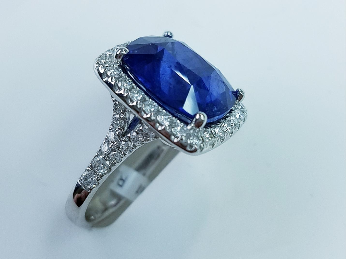 Platinum Cushion Cut Blue Sapphire and Diamond Ring
GIA CERTIFIED
11.06 Carats of Blue Sapphires 14X12MM  African
0.91 Carats of Diamonds
Cushion Cut
