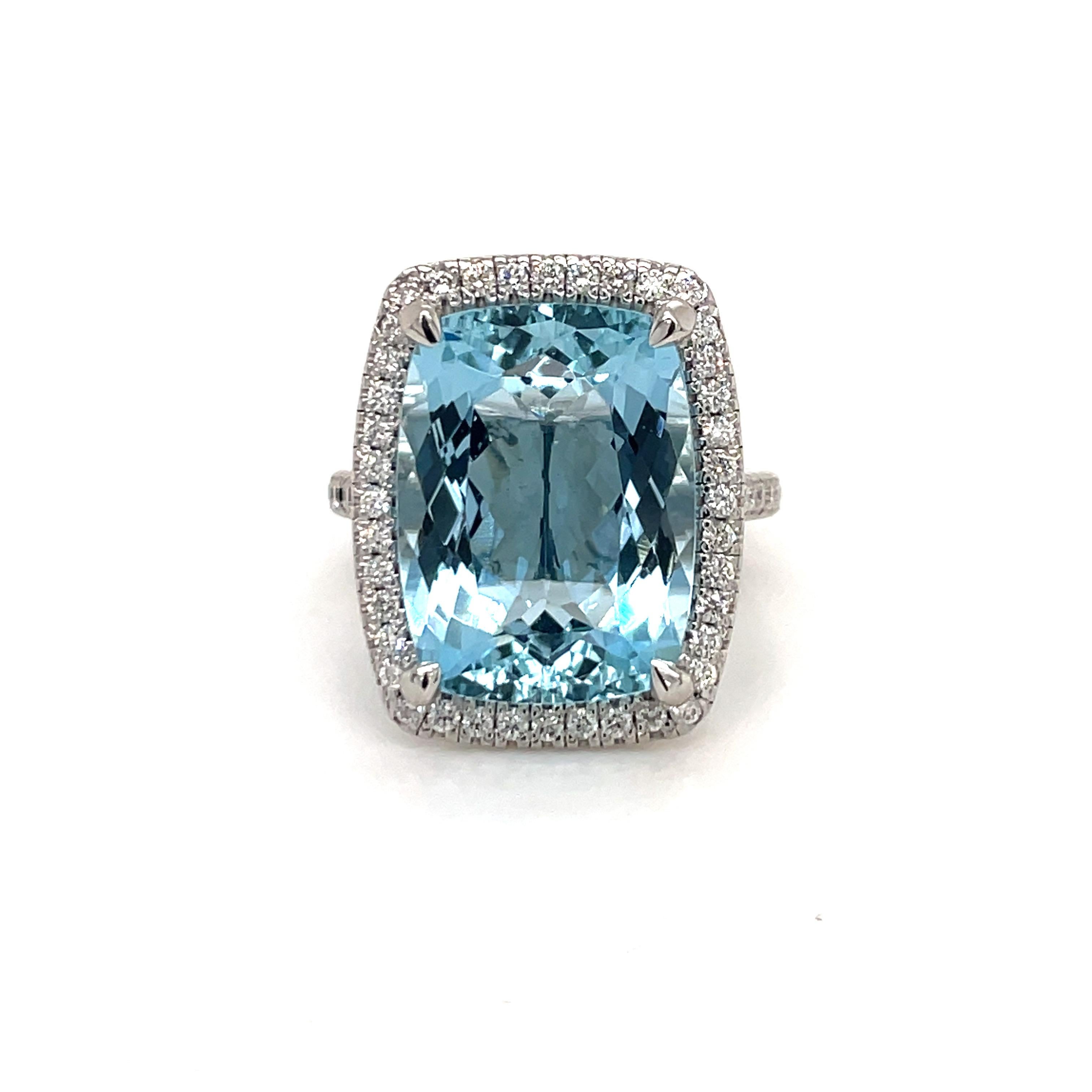 Platinum Cocktail ring featuring one Cushion Cut Aquamarine weighng 10.65 carats flanked with 66 round brilliants weighing 0.73 carats.
Color G
Clarity SI

Aquamarine 
Length: 16.4 MM 
Width: 12.5 MM

Diamond Halo:
Length 20.5 MM
Width: