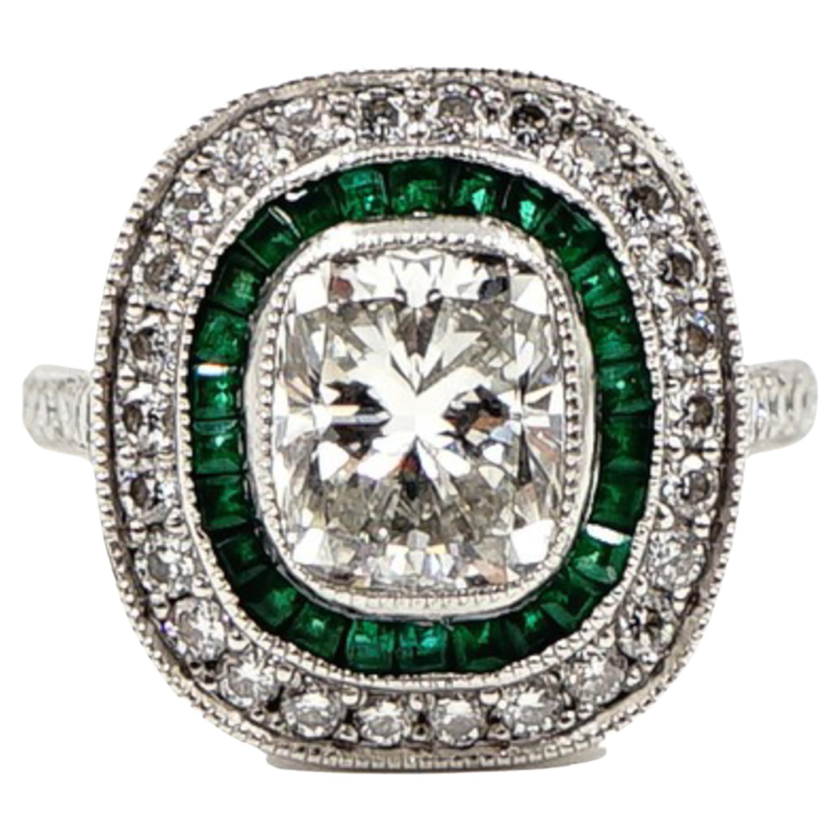 Platinum Cushion Shaped Diamond and Emerald Ring