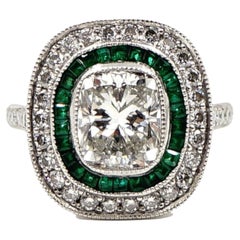 Platinum Cushion Shaped Diamond and Emerald Ring