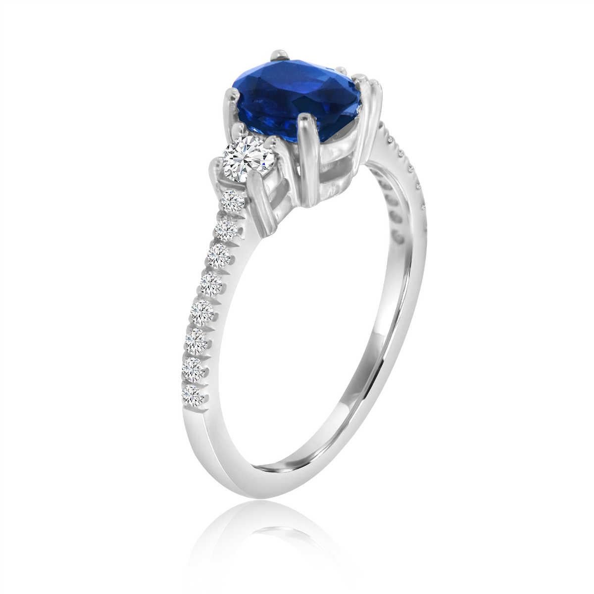 This delicate ring features 1.21 Carat Oval Shape sapphire flanked by two brilliant round diamonds in a total weight of 0.18 carat. A scalloped micro-prong set diamonds in total carat weight of 0.14 carat add a dazzling effect. Experience the