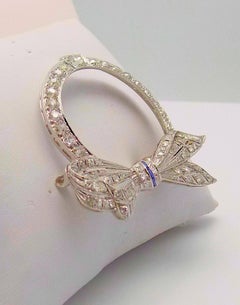Platinum Diamond and Sapphire Art Deco Circle Bow Brooch