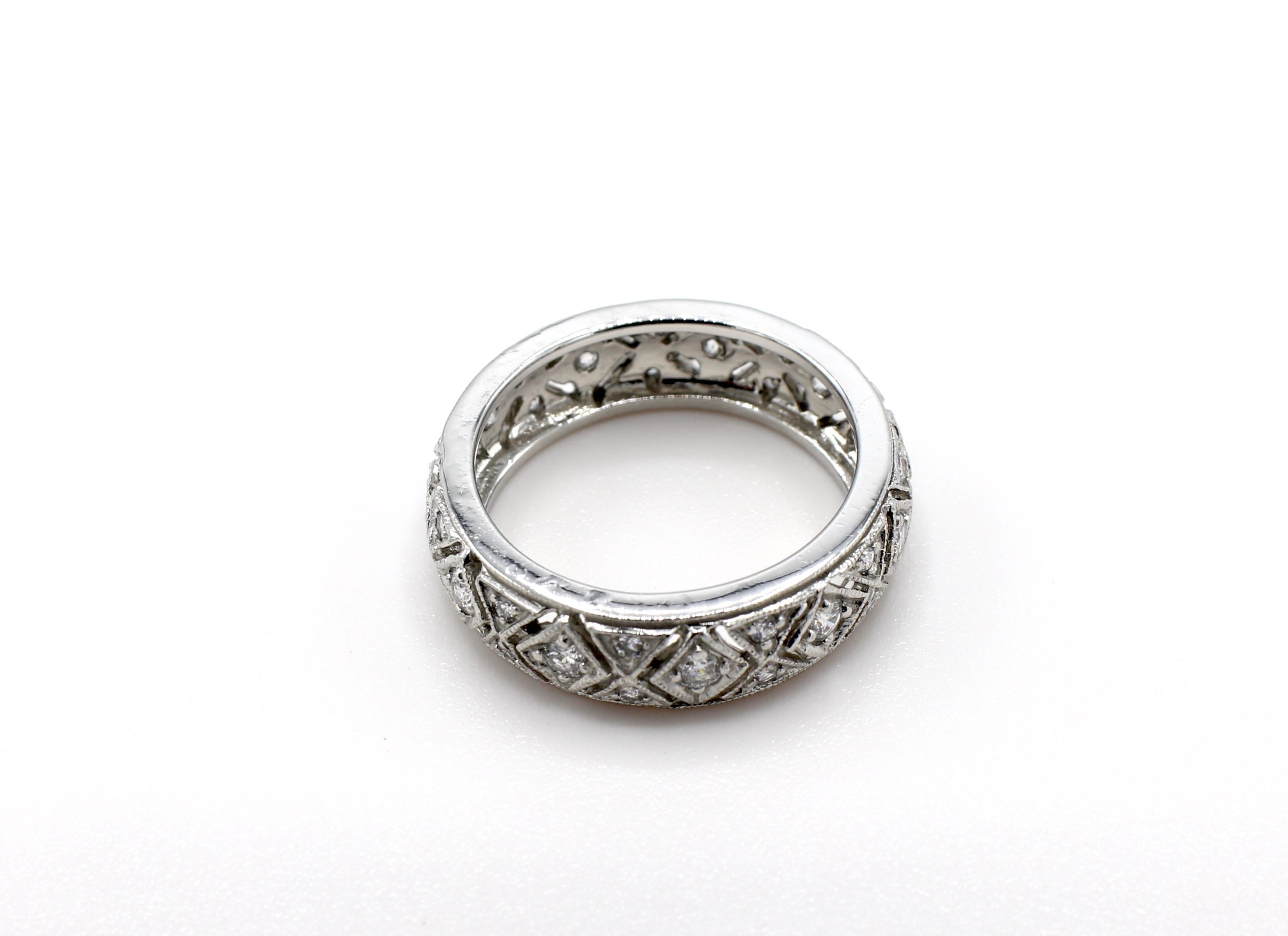 Platinum Diamond 0.55 CTW Filigree Eternity Wedding Band Round Diamonds Ring Size 7

Metal: Platinum
Diamonds: 35 round brilliant cut diamonds approx. 0.55 ctw G-H SI. 
Weight: 8.08 grams
Size: 7 
Markings: This ring has been tested for Platinum but